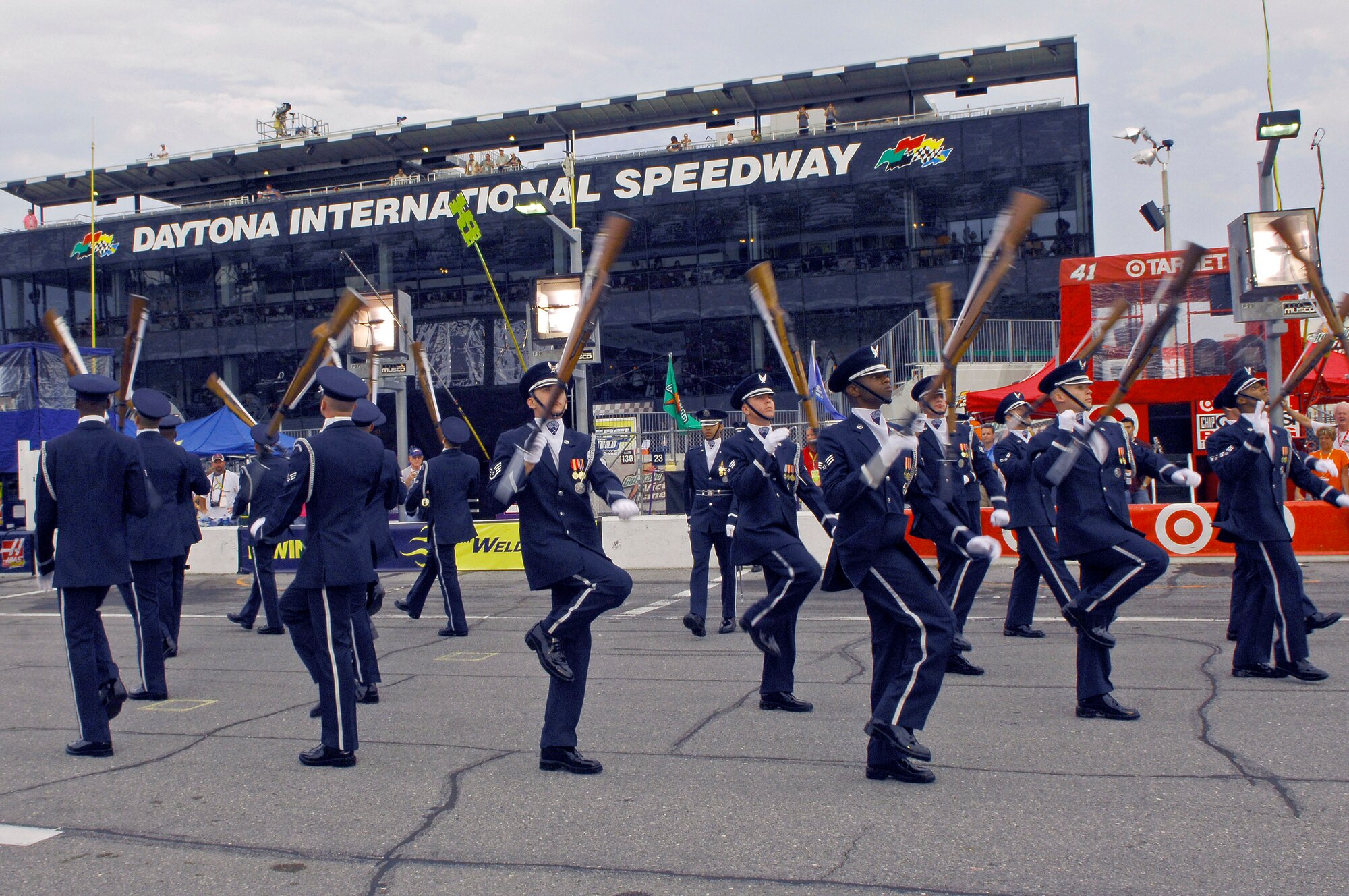 Members of the Air Force Drill Team perform their 16-man sequence in front of more than 150,000 spectators during the pre-race events at NASCAR's Pepsi 400 July 7 in Daytona, Fla. The drill team joined Secretary of the Air Force Michael W. Wynne to represent the Air Force as a part of the "America Supports You" program honoring all servicemembers for the race weekend. The NASCAR event kicked-off the team's current tour, which continues as they visit MacDill Air Force Base and Hurlburt Field, both in Florida. (U.S. Air Force photo/Airman 1st Class Alexandre Montes)