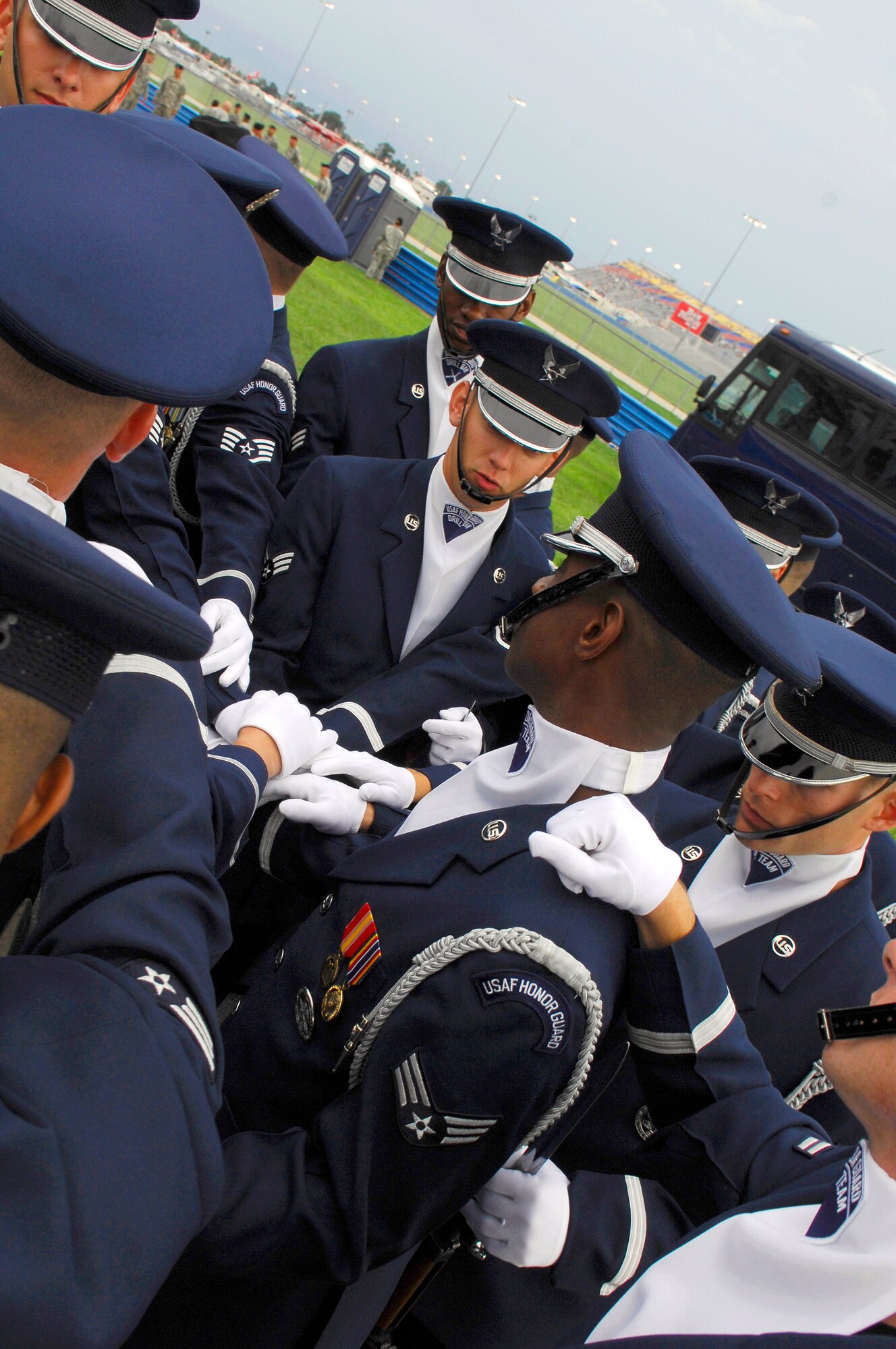 Members of the Air Force Drill Team prepare behind pit row before their NASCAR performance at Daytona International Speedway July 7 in Daytona, Fla. The drill team represented the Air Force during the prerace events at NASCAR's Pepsi 400. The team is the traveling component of the Air Force Honor Guard and tours Air Force bases worldwide showcasing the precision of today's Air Force to recruit, retain and inspire Airmen for the Air Force mission. (U.S. Air Force photo/Airman 1st Class Alexandre Montes)

