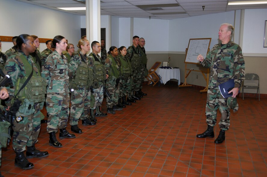 MINOT AIR FORCE BASE, N.D. -- Chaplain (Col.) Brian Hunter, Air Force Space Command command chaplain, addresses members from the 91st Security Forces Group during a shift change July 10. Chaplain Hunter thanked the Airmen for their service and explained how chaplains serve side-by-side with them, leading worship services and observances and providing pastoral care, (U.S. Air Force photo by Airman 1st Class Joe Rivera)
