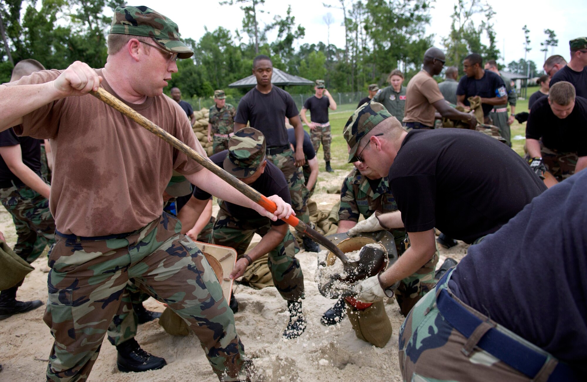Team MacDill members fill sand bags as part of Operational Readiness Inspection training. MacDill servicemembers traveled to Gulfport, Miss., June 24, for a four-day ability to survive and operate training course in preparation for the upcoming ORI. (U.S. Air Force photo by Tech. Sgt. Sean White)