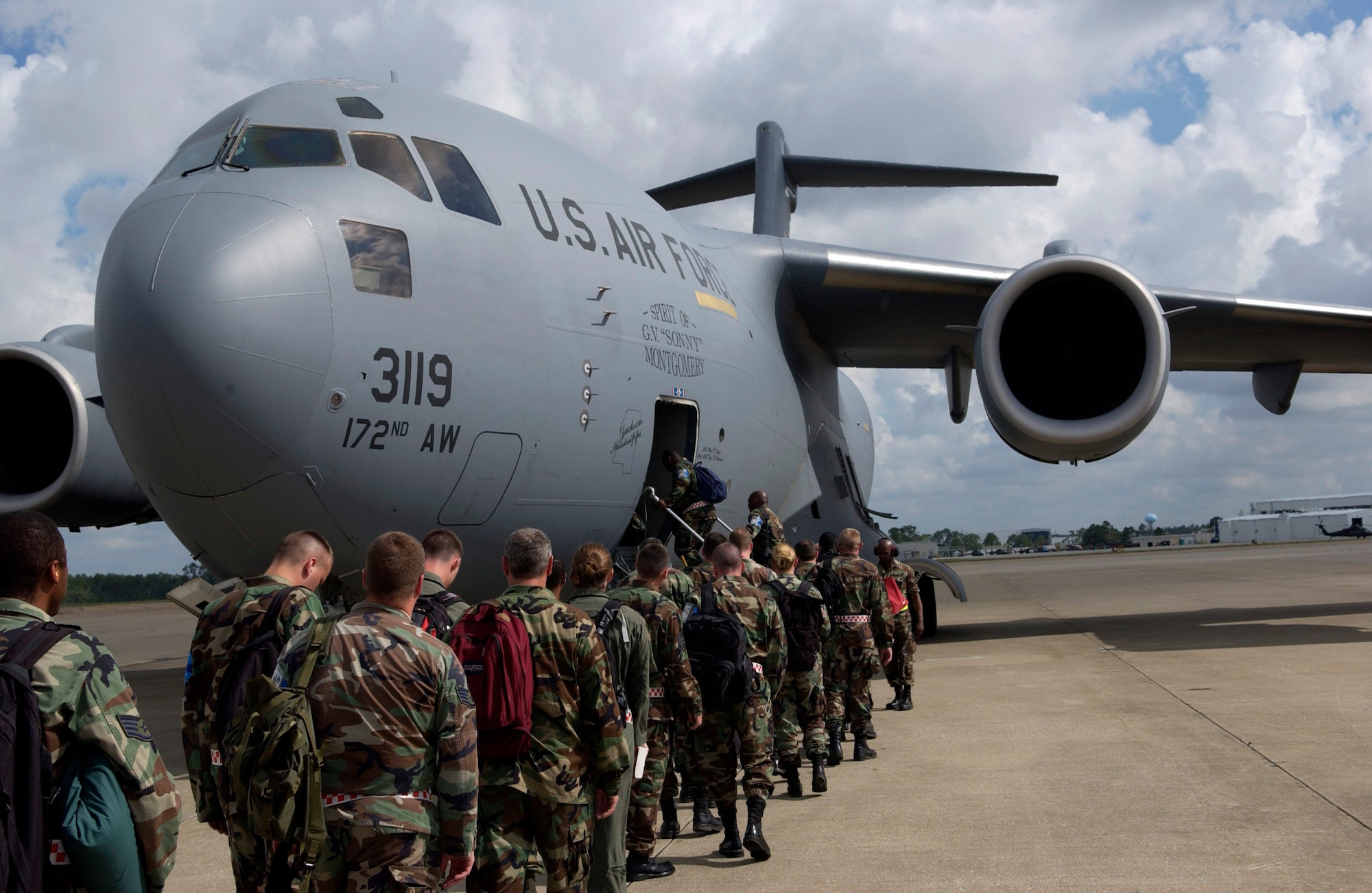 Members of the 6th Air Mobility Wing board a C-17 for the return to MacDill. MacDill servicemembers traveled to Gulfport, Miss., June 24, for a four-day ability to survive and operate training course in preparation for the upcoming Operational Readiness Inspection. (U.S. Air Force photo by Tech. Sgt. Sean White)