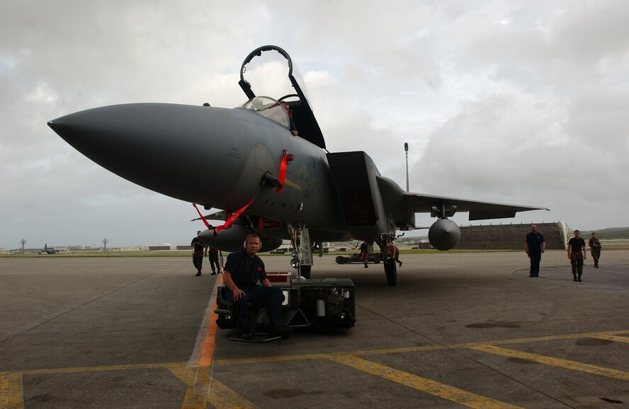KADENA AIR BASE, Japan -- An F-15C Eagle is towed safely to a protective aircraft shelter in preparation for Typhoon Man-Yi here July 12. The 44th and 67th Aircraft Maintenance Units are working together to have all fighter aircraft stored before the arrival of Okinawa’s first typhoon of the year. (U.S. Air Force photo by Staff Sgt. Reynaldo Ramon)