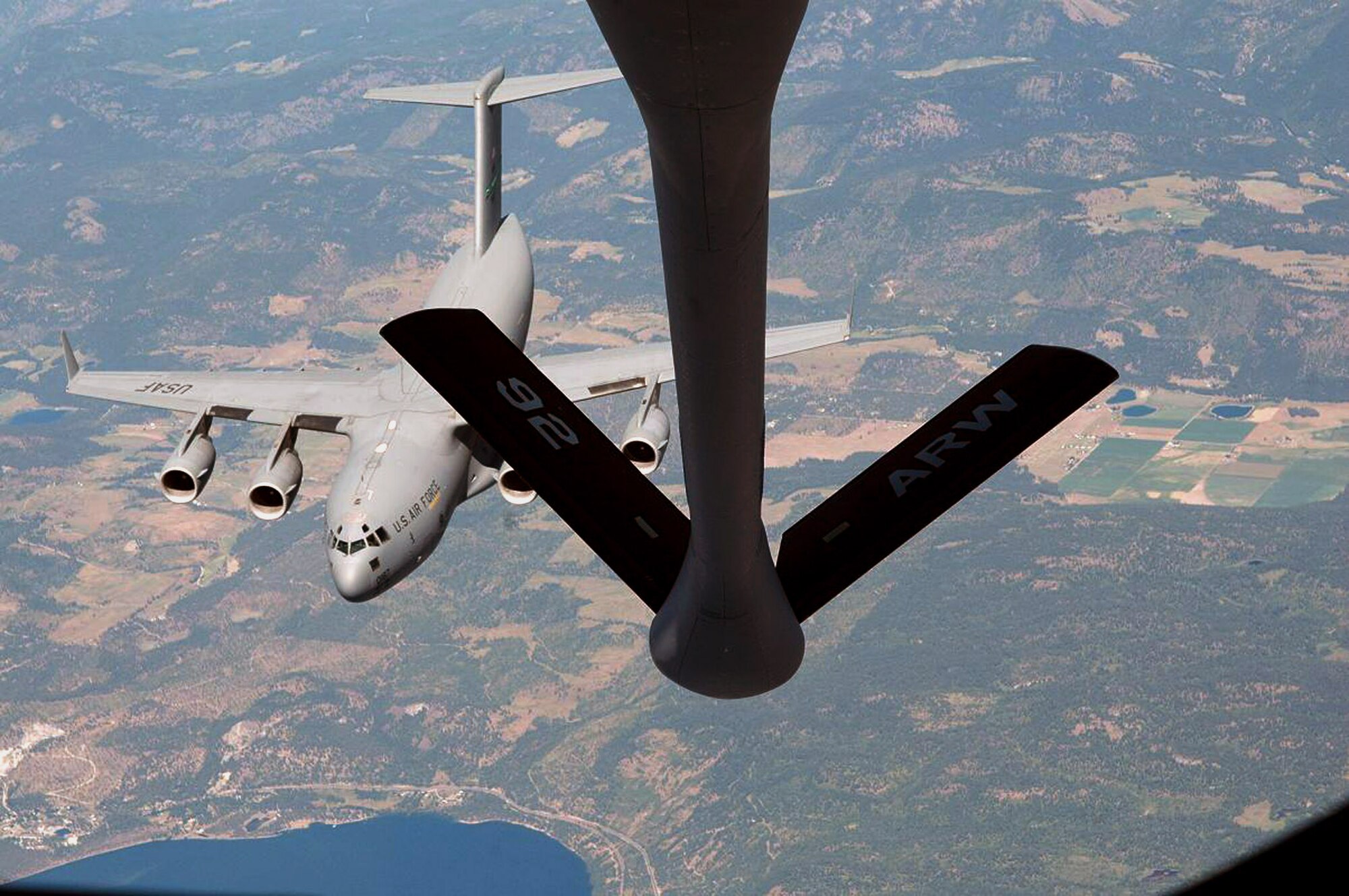 A KC-135 Stratotanker from the 92nd Air Refueling Wing at Fairchild Air Force Base, Wash., prepares to refuel a C-17 Globemaster III from the 62nd Airlift Wing at McChord AFB, Wash.  The July 10th training sortie over north-central Washington was in preparation for the Air Mobility Command Rodeo 2007 to be held at McChord AFB July 21-28. (U.S. Air Force photo/1st Lt. Tristan Hinderliter)