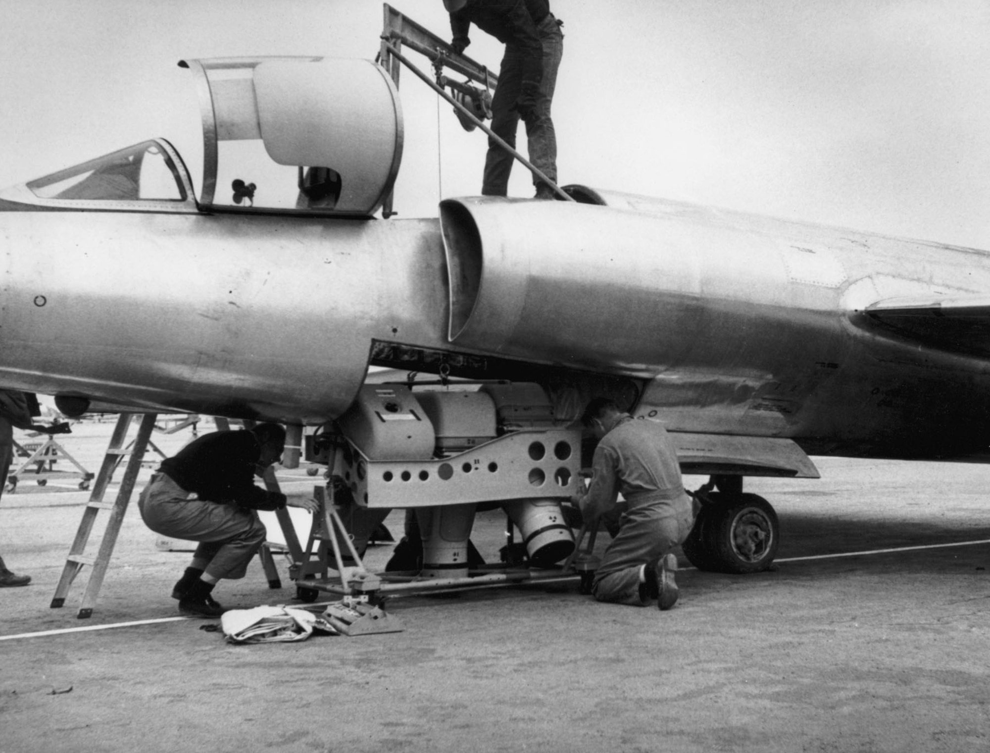 Technicians load a type A-2 camera set into a U-2’s equipment bay or “Q-bay.” This camera configuration was used on the first U-2 Soviet overflight on July 4, 1956. (U.S. Air Force photo)