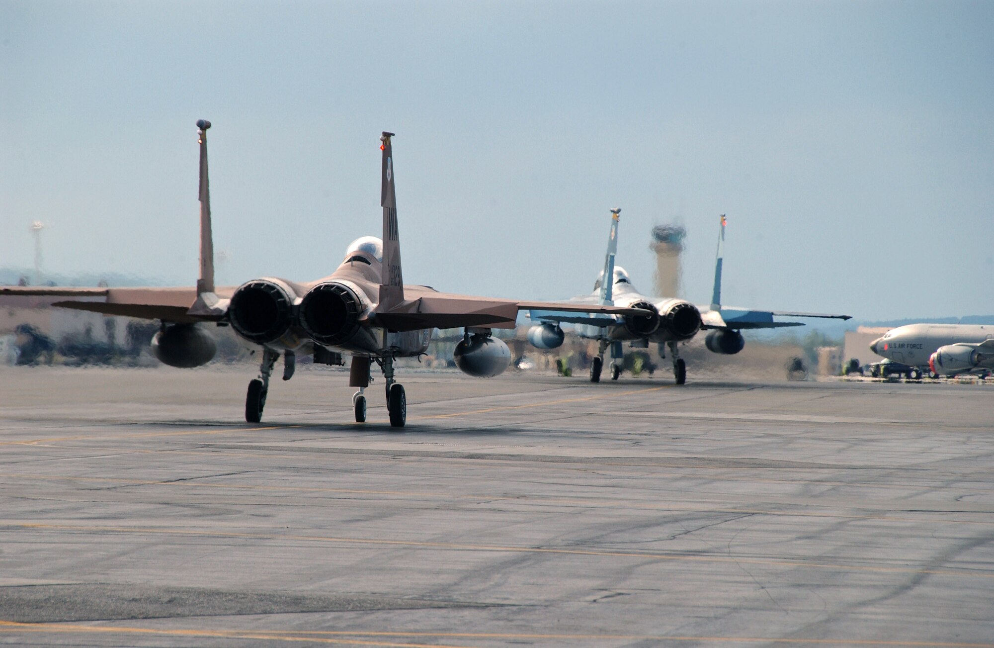 Two F-15 Eagles taxi to the runway July 10 at Eielson Air Force Base, Alaska, prior to a training exercise.  These exercises are part of Red Flag-Alaska 07-3, a multi-service, multi-platform coordinated, combat operations exercise, which runs through the July 27.  (U.S. Air Force photo/Airman 1st Class Christopher Griffin)