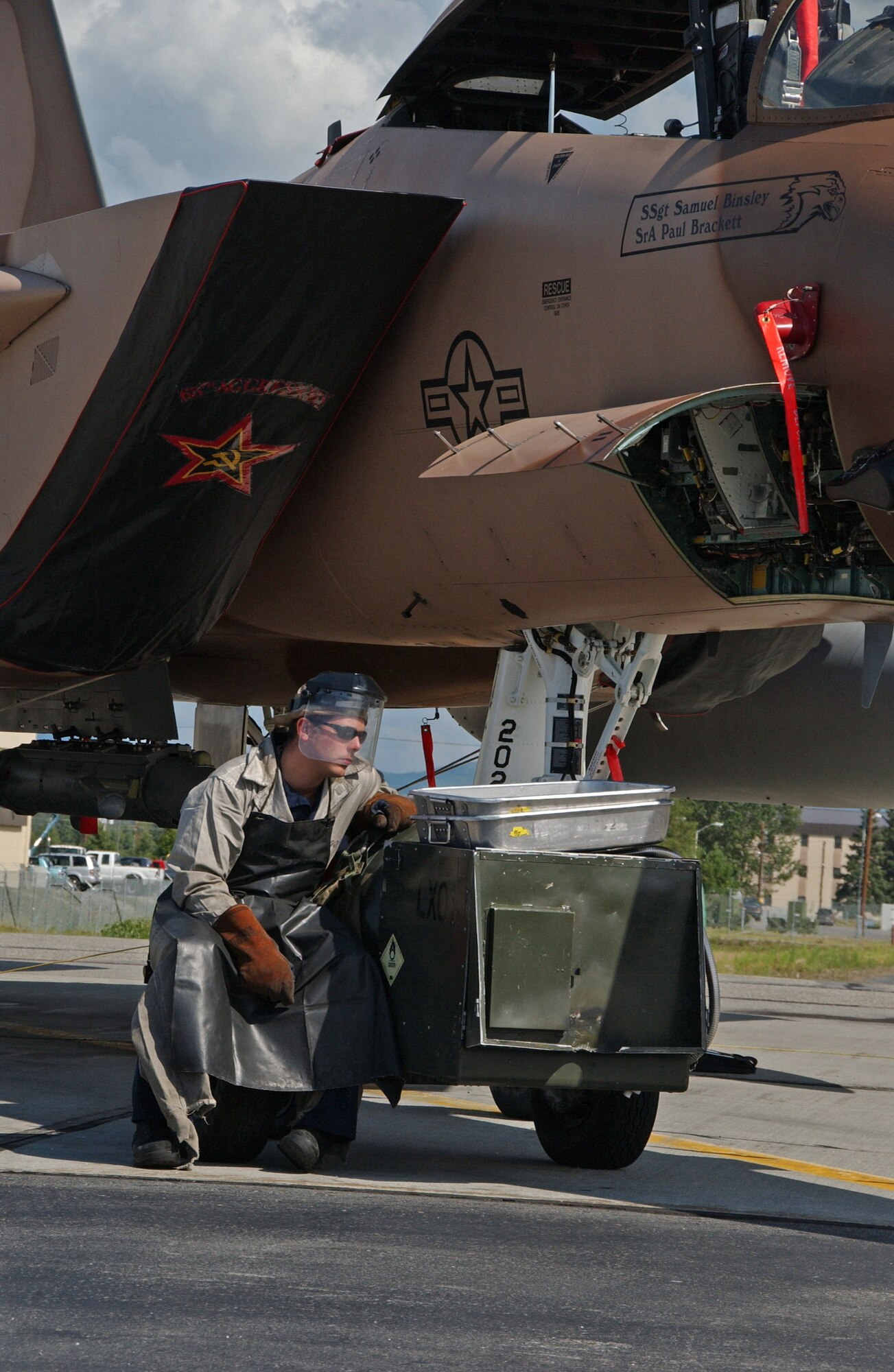 Airman 1st Class Zachary Garretson services the liquid oxygen system on an F-15 Eagle July 9 on the Eielson Air Force Base, Alaska, flightline. The aircraft, from the 65th Aggressor Squadron at Nellis AFB, Nev., is at Eielson AFB to take part in Red Flag-Alaska 07-3, a multi-service, multi-platform coordinated, combat operations exercise, which runs through the July 27.  Airman Garretson is a maintainer with the 57th Aircraft Maintenance Squadron at Nellis AFB.  (U.S. Air Force photo/Airman 1st Class Christopher Griffin)