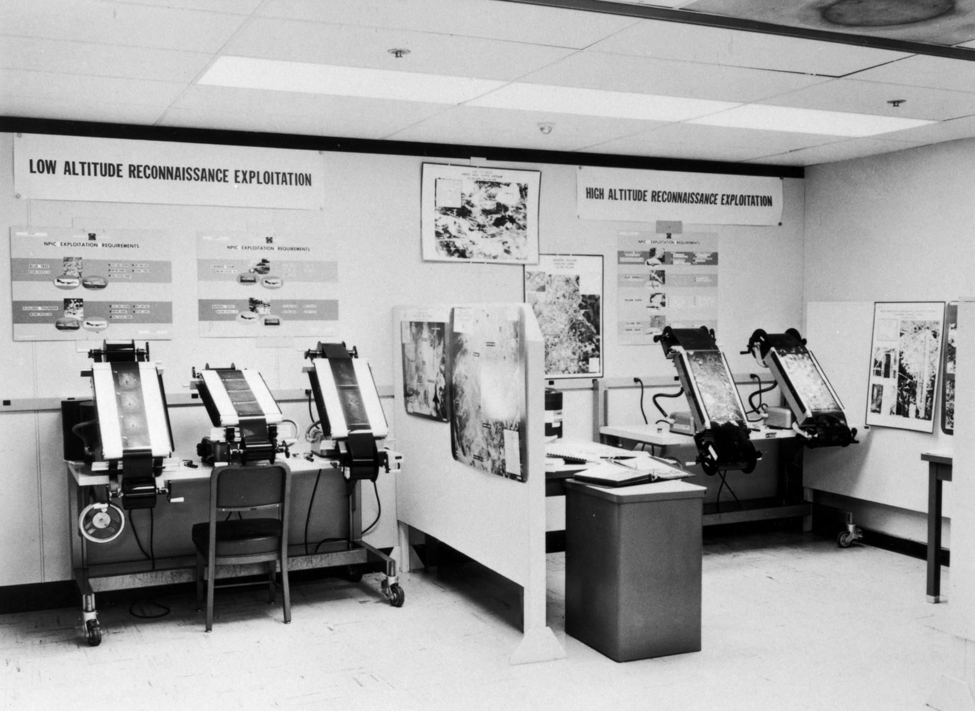 Inside the National Photographic Interpretation Center during the Cuban Missile Crisis. Here, photo interpreters pored over large-format negatives brought back by USAF U-2 and RF-101 reconnaissance aircraft for evidence of Russian missiles. (U.S. Air Force photo)