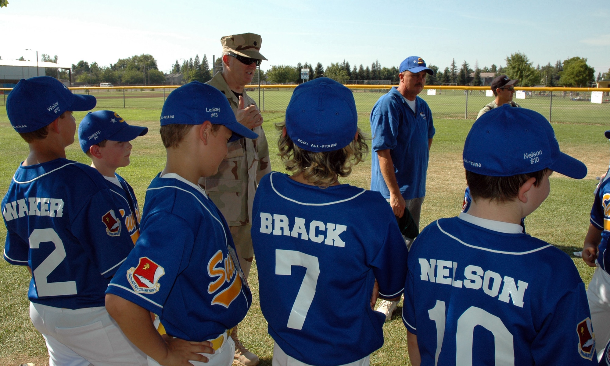 Lt. Col. Tim McCoy, 940th Mission Support Group commander, visits with the Sunrise Little League all-star team. The team is wearing the patch of the 940th Air Refueling Wing, Beale AFB, Calif., on the sleeves of their uniforms to honor their military heroes. Lt.Col McCoy thanked the team and cheered them on to their first victory. The wing has 26 Reservists deployed in support of the Global War on Terror. (U S Air Force photo/Master Sgt. Ellen L Hatfield