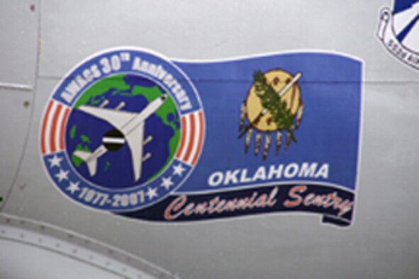 TINKER AIR FORCE BASE, Okla -- 1st Lts. Chris Chester and Gerrit Dalman, 964th Airborne Air Control Squadron, designed the E-3 Sentry 30th anniversary noseart, which was unveiled during the opening ceremony June 29.  The E-3 Sentry celebrated its 30th anniversary throughout the weekend by inviting past and present E-3 Airmen to Tinker for tours, briefings and a banquet with Gen. Ronald Keys, Air Combat Command commander, as the guest speaker.  (Photo by Senior Airman Lorraine Amaro)