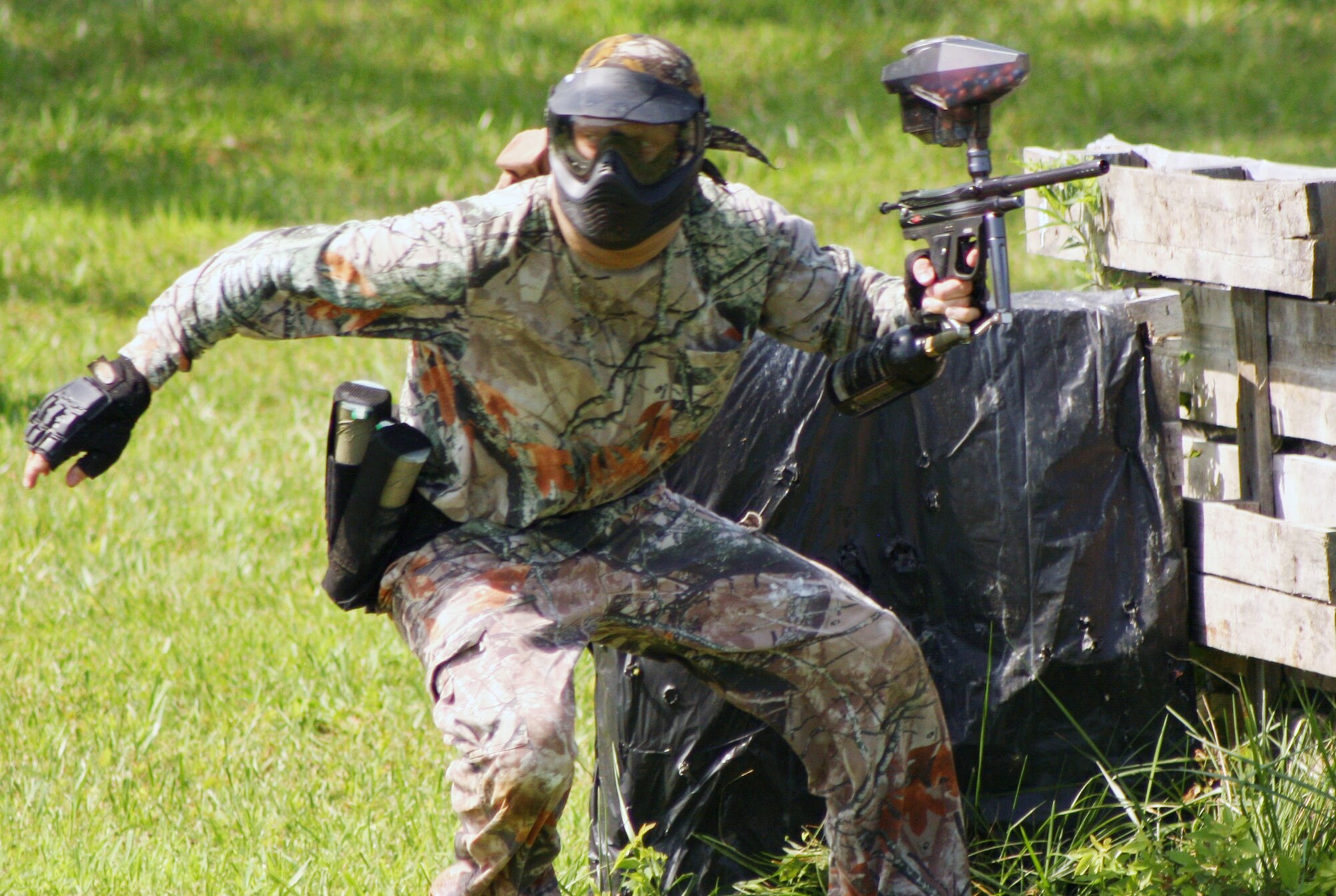 WHITEMAN AIR FORCE BASE, Mo. -- Lt. Col. Brian Zembraski, 509th Bomb Wing, heads for better cover during the "Doc Pappy J" Hooah Lock-and-Load Paintball Tournament July 7 at Area 509. More than 25 competitors took part in the tourney won by the Northrop-Grumman team. For more information on paintball tournaments on base, call outdoor recreation at 687-5565. (U.S. Air Force photo/Tech. Sgt. Matt Summers)