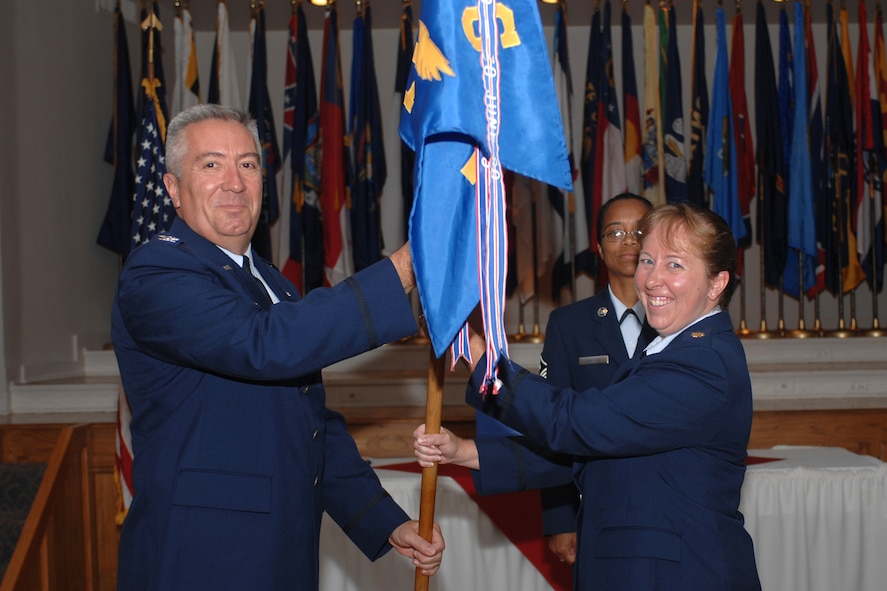 DYESS AIR FORCE BASE, Texas-- Maj. Eileen Kirkland assumes command of the 7th Services Squadron from Col. James Hammes III, 7th Mission Support Group commander at a change of command ceremony June 29. The outgoing commander is Lt. Col. Andreas Walsh. (U.S Air Force photo by Airman 1st Class Felicia Juenke)