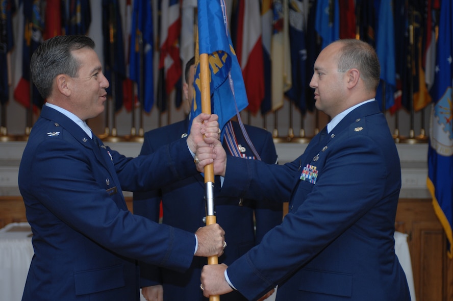 DYESS AIR FORCE BASE, Texas -- Major Brian Mikus  assumes command of the 7th Munitions Squadron from Colonel Richard Kosanke June 25. (U.S. Air Force photo by Airman 1st Class Jennifer Romig)