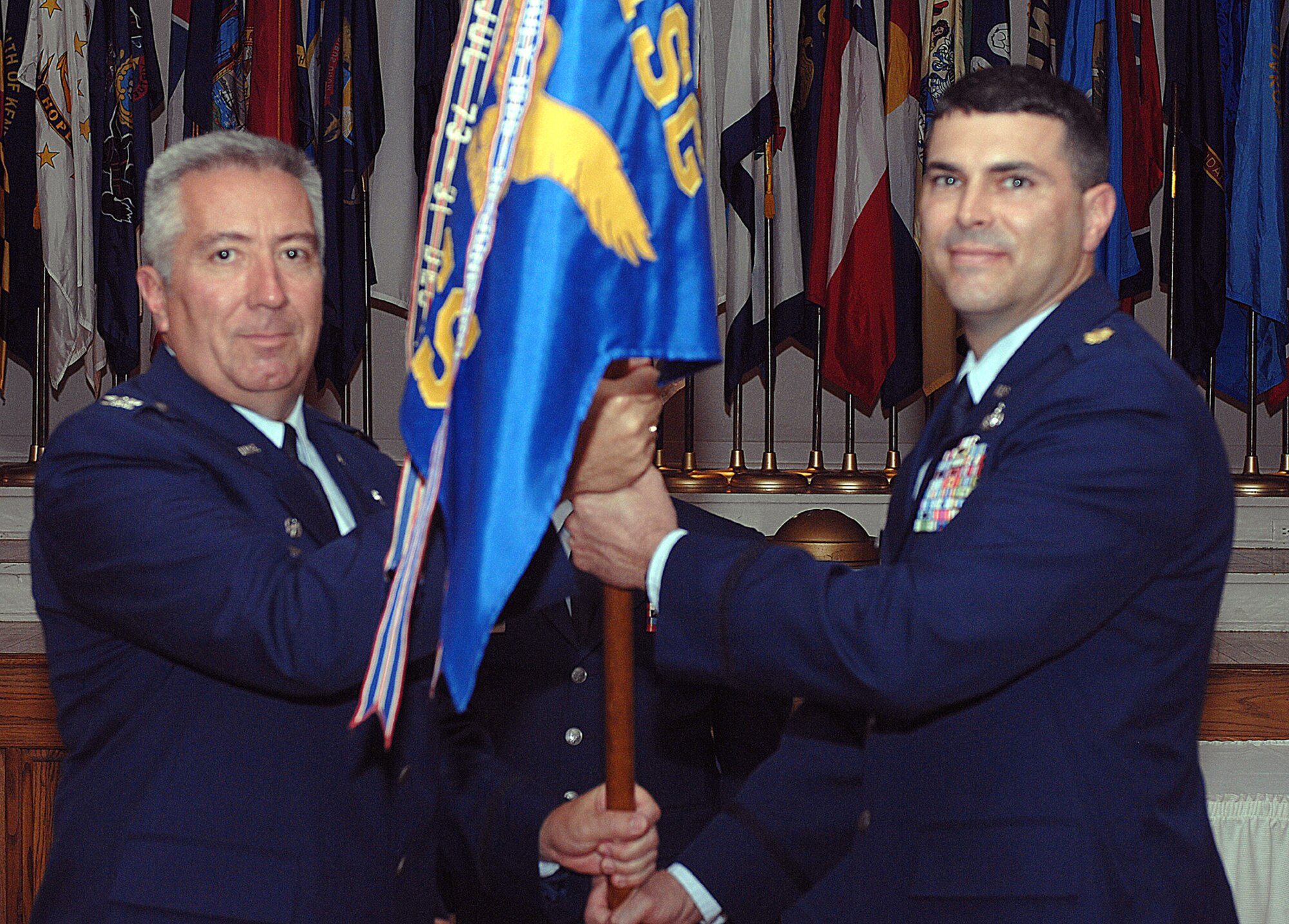 DYESS AIR FORCE BASE, Texas -- Major Kelly Kanapaux assumes command of the 7th Communtications Squadron from Colonel James Hammes, 7th Mission Support Group commander, at a change of command ceremony July 9. (U.S. Air Force photo by Airman 1st Class Jennifer Romig)