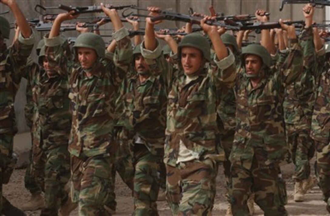 Candidates for the Iraqi Police Emergency Response Unit, an elite component of the Iraqi security forces, receive corrective training as they march to their next block of instruction at Forward Operation Base Kalsu in North Babil, Iraq, July 10, 2007. 