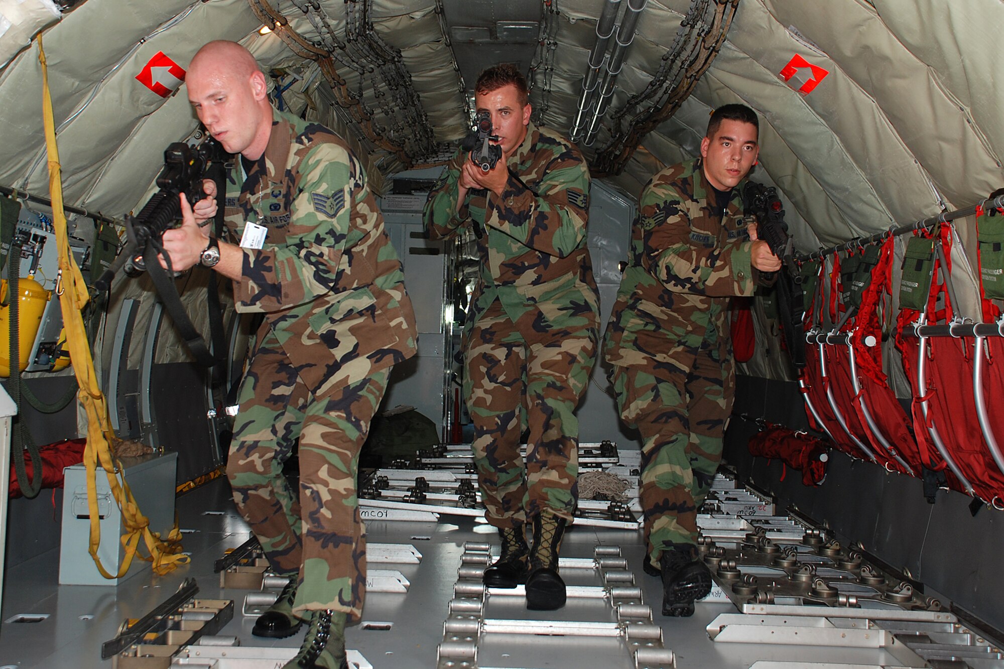 Rodeo team trainer Staff Sgt. Christopher Somers, 22nd Security Forces Squadron and and team members, Staff Sgt. Joseph Kitchen, 22nd Security Forces Squadron, and Staff Sgt. Gregory Podobensky, 22nd Security Forces Squadron practice securing aircraft from a simulated attack July 9 in preparation for this year’s Air Mobility Command’s Rodeo competition July 22-28, McCord Air Force Base, Wash. (Photo by Airman 1st Class Jessica Lockoski)
