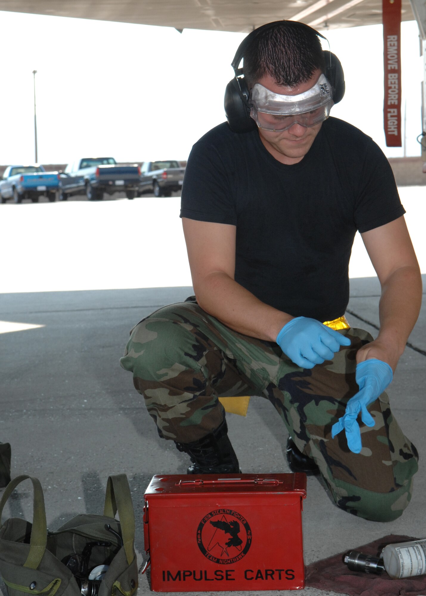 Airman1st Class Branden Sharp, 8th Aircraft Maintenance Unit  weapons load crew member, prepares his tools during the Weapons Standardization Load Crew of the Quarter Competition July 9. The Competition evaluates technical proficiency, safety procedures and overall time on a F-117A.  (U.S. Air Force photo by Senior Airman Anthony Nelson Jr.)
