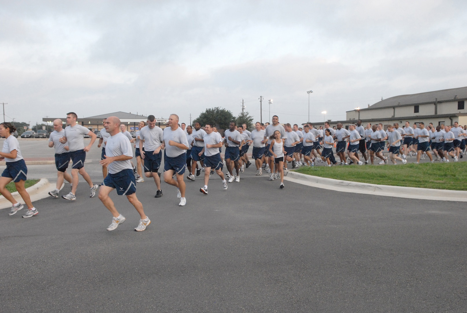 Members of Team Lackland enjoy the Bang for your Buck Family Fun Run held July 11. The fun runs are one of many ways that Lackland's sports and fitness program promotes fitness on base. The program recently received the Air Education and Training Command Fitness and Sports Program of the Year award for their efforts. (USAF photo by Alan Boedeker)