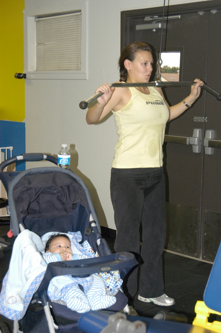 With the opening of the new family fitness room at the Warhawk Fitness Center on Lackland Air Force Base, Texas, Wendy Wong no longer has to decide between working out and staying home to watch the baby. Mrs. Wong is the wife of Staff Sgt. Danny Wong, 759th Medical Operations Squadron. (USAF photo by Mandi Cruz)                                