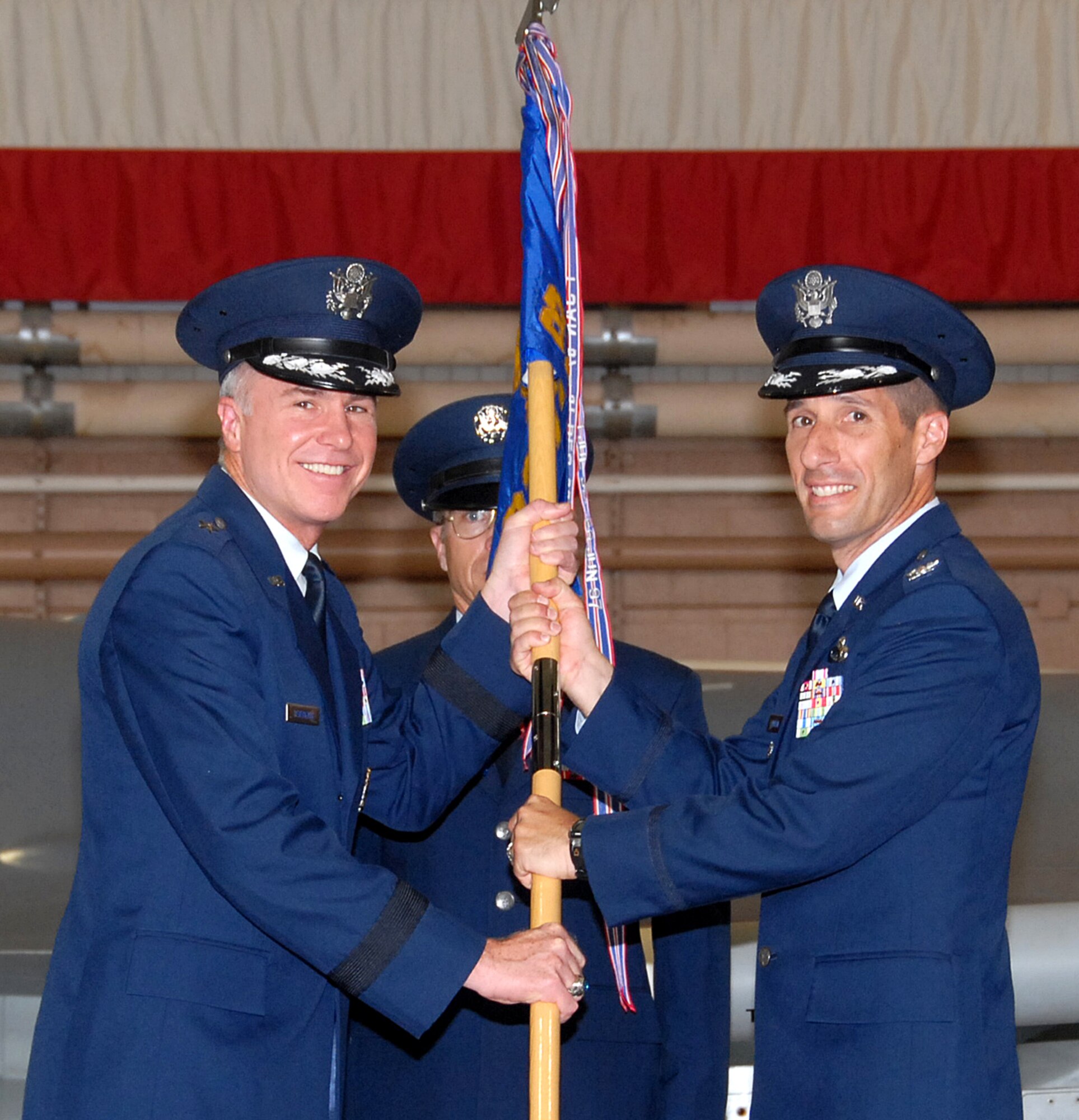 Brig. Gen. Richard Devereaux, 82nd Training Wing commander, passes command of the 82nd Training Group to Col. Steven Morani during the Assumption of Command ceremony July 11. (U.S. Air Force photo/Mike Litteken)