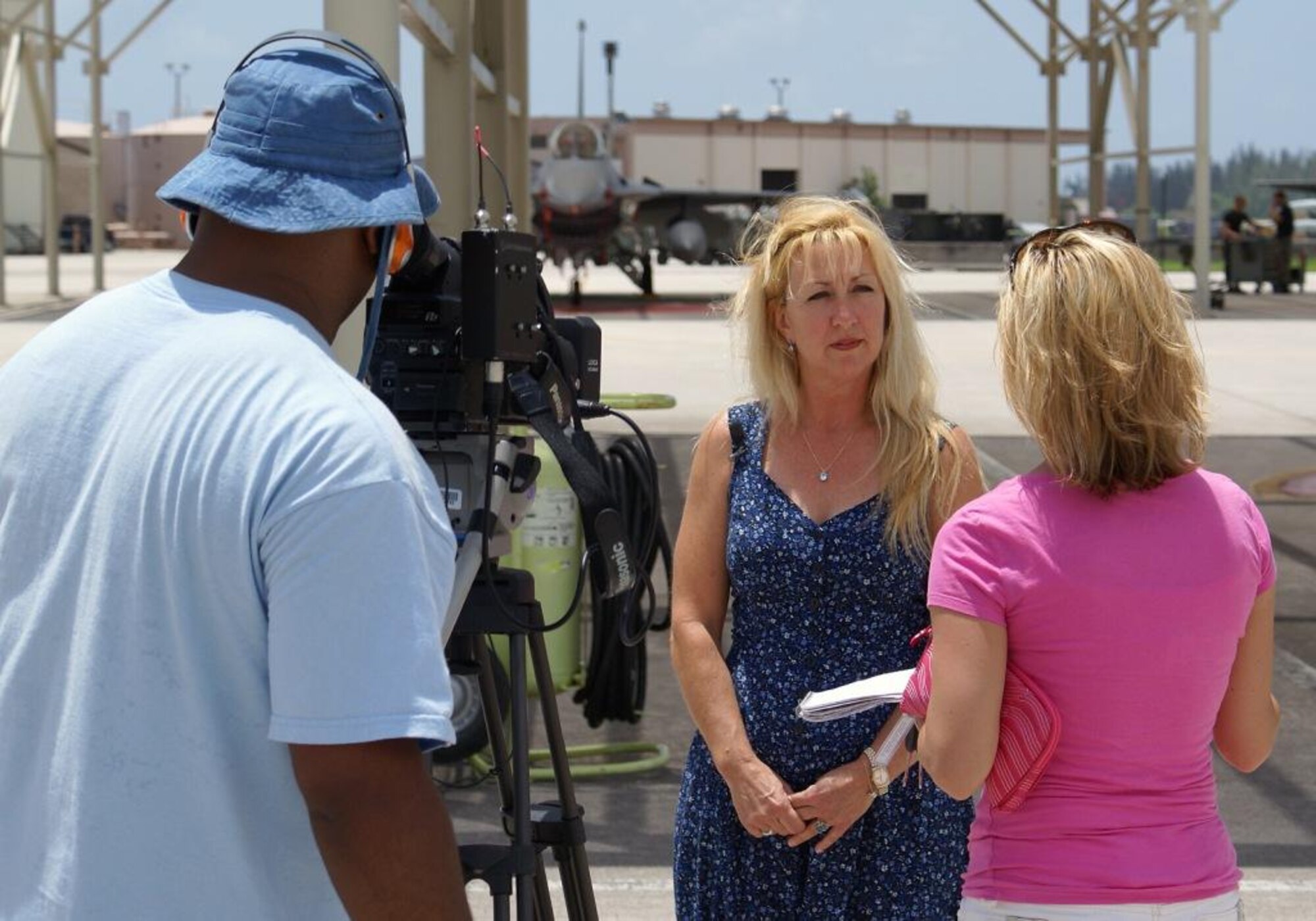 Carol Makin of the 482nd Operations Group (center) recounts her experiences from Hurricane Andrew in 1992 with a media crew from the Weather Channel. The crew visited Homestead Air Reserve Base July 11, interviewing several members of the 482nd for a series on the storm's 15-year anniversary scheduled to air the week of August 20 on the cable channel. (U.S. Air Force photo/Dan Galindo)
