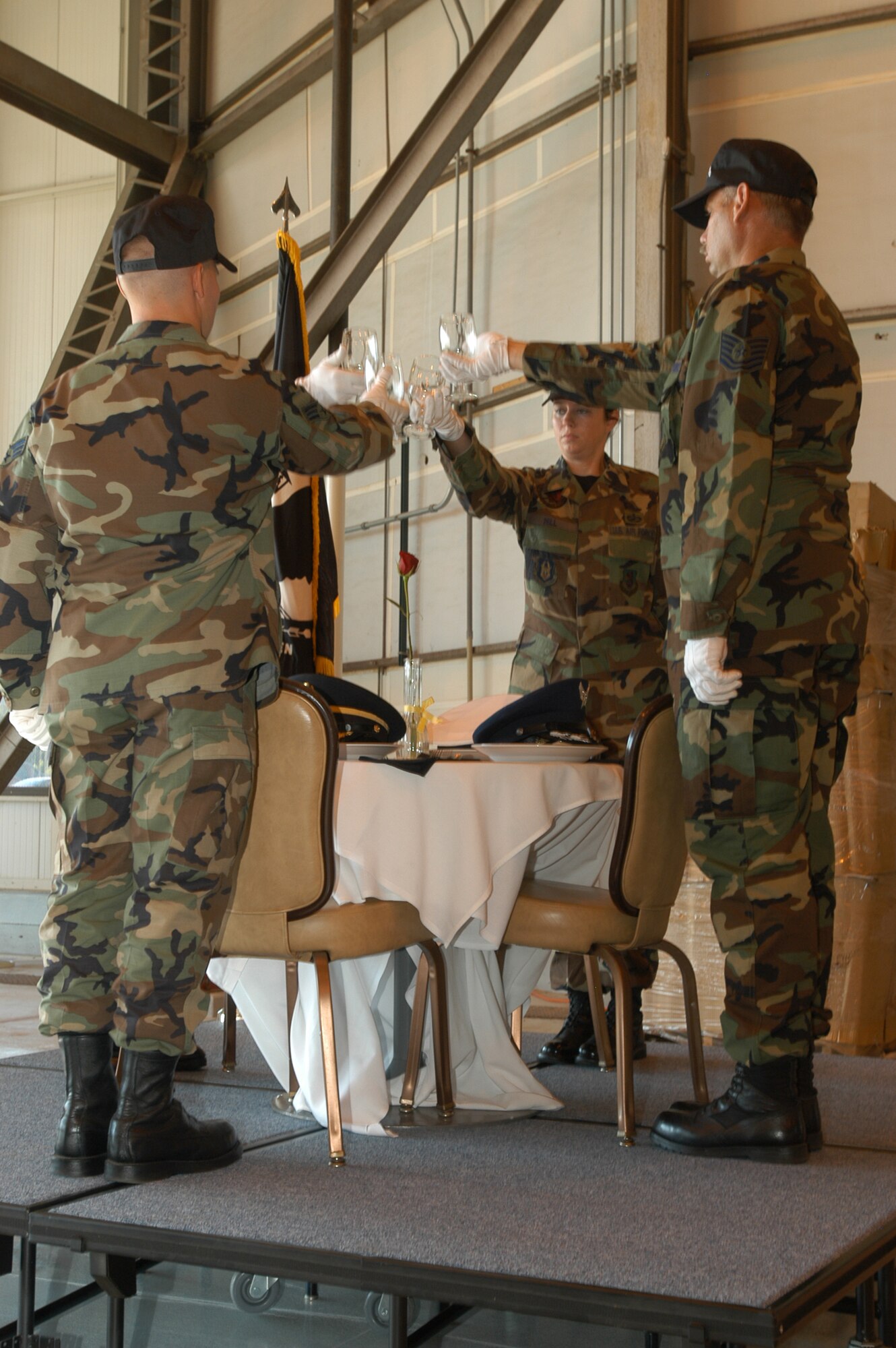 GRISSOM AIR RESERVE BASE, Ind., -- Members of the Grissom Honor Guard perform a ceremony remembering POW and MIAs during the Combat Dining in held here July 7. Grissom members shared an evening of laughs, comaradarie and morale building. (U.S. Air Force photo/Staff Sgt. Mark Orders-Woempner)