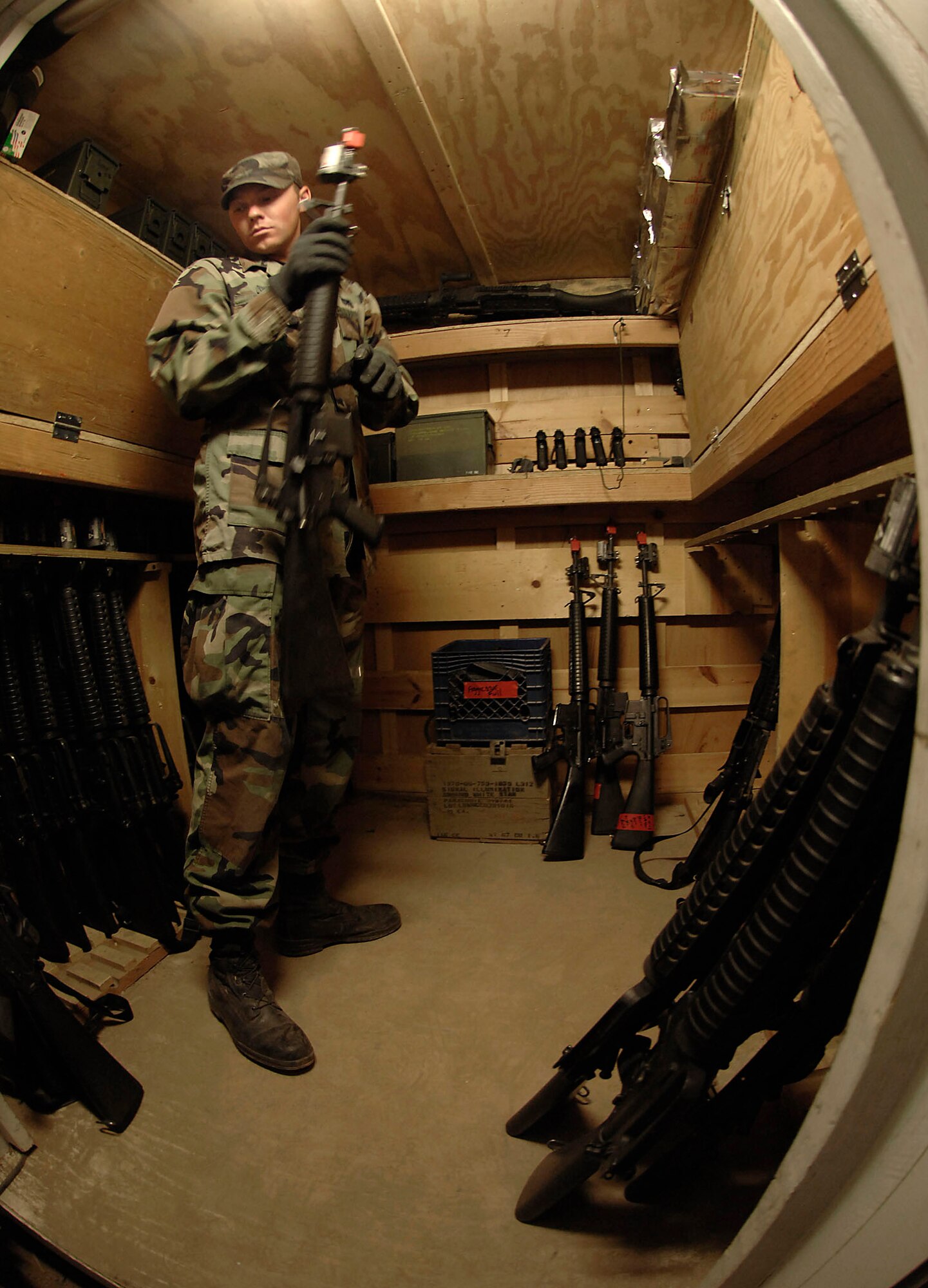Cadet 1st Class Ryan Weaver prepares and checks weapons before handing them out to cadets during the Global Engagement course July 10 at the U.S. Air Force Academy in Colorado. The purpose of Global Engagement is to lay the foundation for Air Force Academy cadets of attitudes, knowledge and skills necessary to lead, fight, and win in a dynamic and diverse global environment. (U.S. Air Force photo/Tech. Sgt. Larry A. Simmons) 
