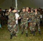 Trainees from the 322nd Training Squadron at Lackland Air Force Base, Texas, kick up their heels during the 2007 Star Spangled Festival at the Lackland Amphitheater grounds. Performing the Boot Scootin' Boogie left to right are Natalie Small, Christina Dennison, Brittany Elkins and Victoria Sutherland. (USAF photo by Alan Boedeker)
                               