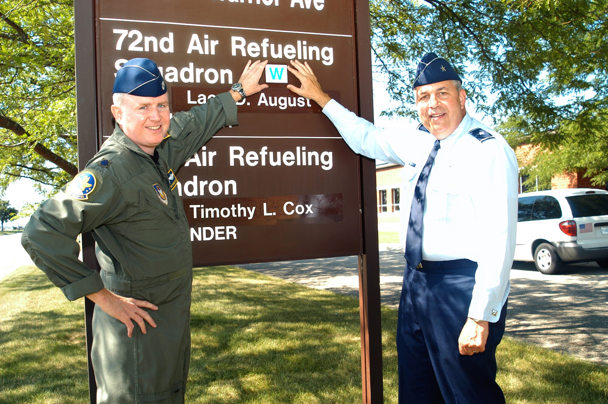 GRISSOM AIR RESERVE BASE, Ind., -- Brig. Gen. Dean Despinoy, 434th Air Refueling Wing commander, right, and Lt. Col Thom Pemberton, director of operations for the 72nd Air Refueling Squadron, place a 'W' on the sign, in front of their building, to indicate that the unit received the Warrior Award.  The Warrior Award is a new program created by the general as a motivational tool for Grissom members to keep caught up with training and other items needed in order to be deployed. (U.S. Air Force photo/SrA. Ben Mota)