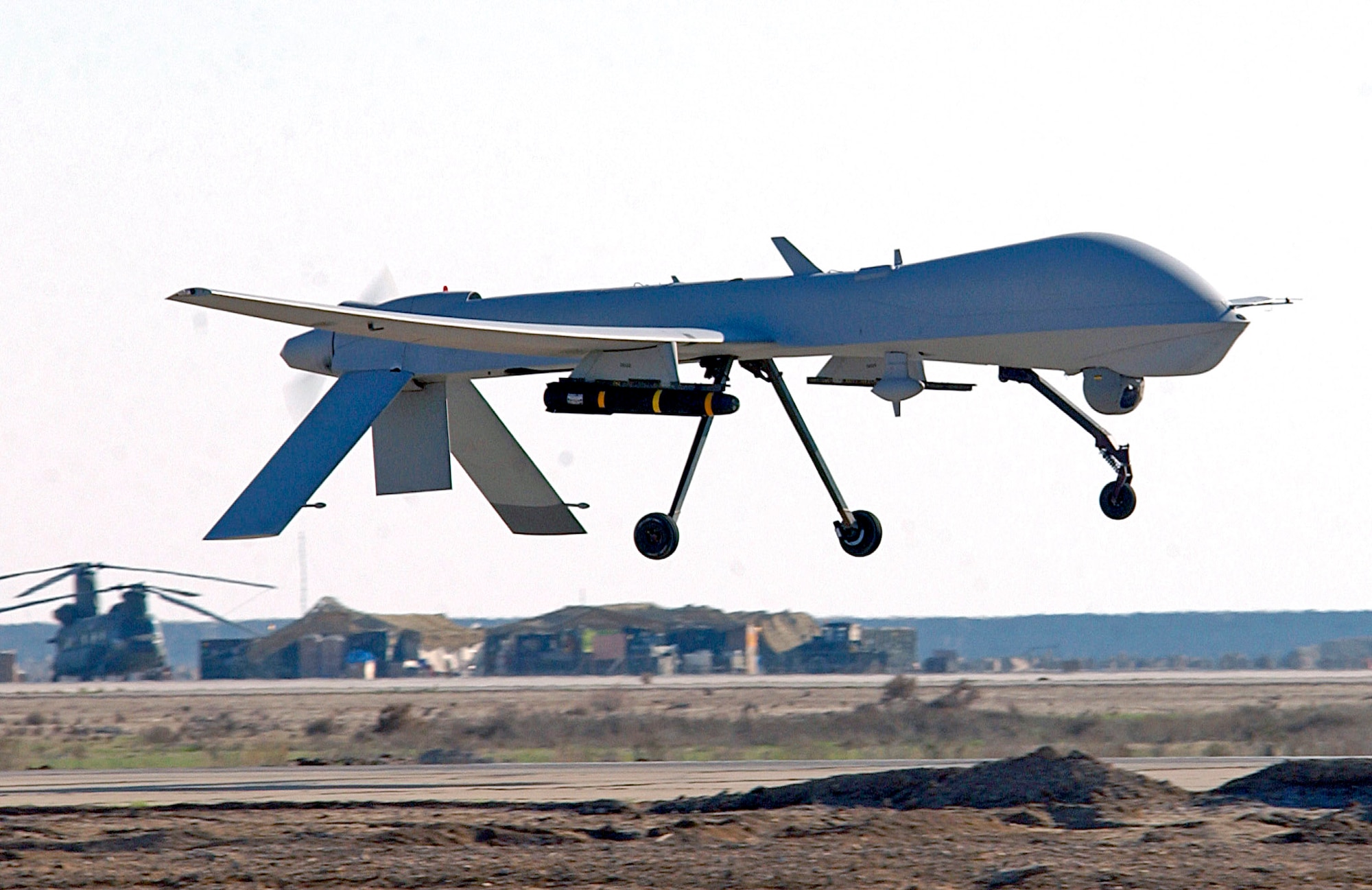 An MQ-1 Predator unmanned aerial vehicle lands at a base in Southwest Asia.  The Predator is a remotely piloted vehicle that interdicts and conducts armed reconnaissance against critical, perishable targets.  (U.S. Air Force photo/Staff Sgt. Suzanne M. Jenkins)