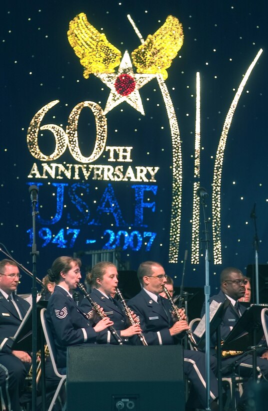 The Air Force Band of Flight performs at the Air Force Materiel Command Tattoo ceremony at Wright-Patterson Air Force Base June 29.  A crowd of more than 60,000 from southwest Ohio, eastern Indiana and northen Kentucky were treated to patriotic music, aircraft flyovers and fireworks during the 60th Anniversary of the U.S. Air Force commemorative event. (Spencer P. Lane/U.S. Air Force)
