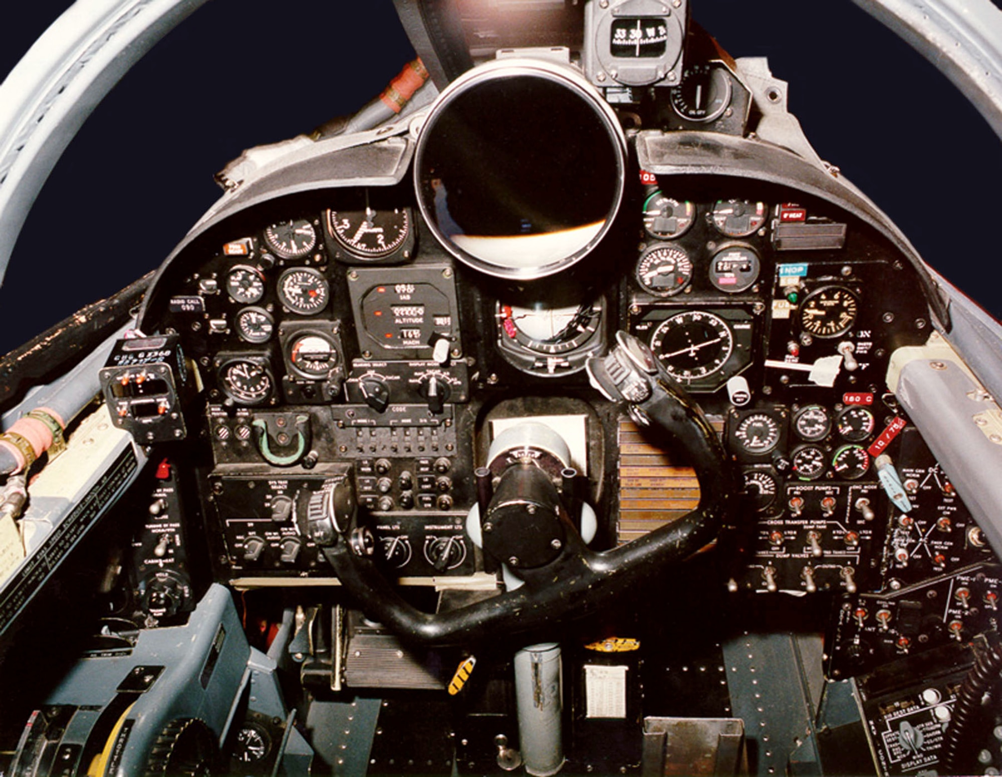 The older U-2 cockpit used traditional dials and a large “driftsight” telescope to help the pilot see the landscape below. (U.S. Air Force photo)