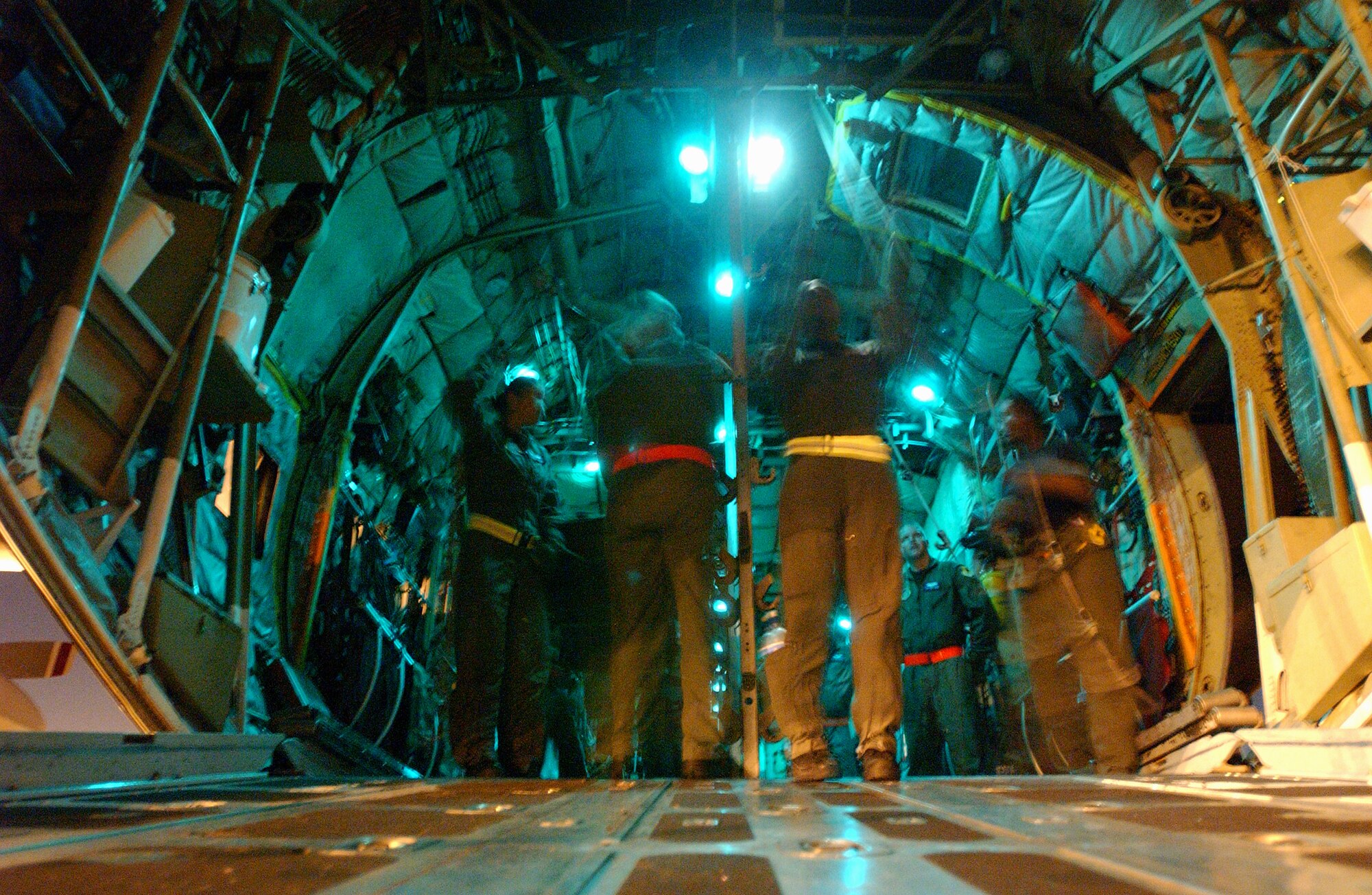 Members of the 18th Aeromedical Evacuation Squadron , Kadena Air Base, Japan, simulate evacuating casualties from a C-130 Hercules at Marine Corps Air Station Futenma, Japan, in preparation for Air Mobility Rodeo  2007. The unit practiced in the evenings to simulate night time operations for wartime missions. U.S. Air Force photo/Staff Sgt. Reynaldo Ramon


