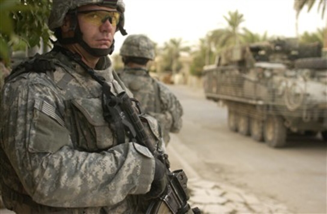 U.S. Army Spc. Johnathon Stewart pauses during a search for insurgents in Rashid, Iraq, on July 11, 2007.  Stewart is with 1st Platoon, Alpha Company, 2nd Battalion, 3rd Infantry Regiment, 3rd Brigade Combat Team, 2nd Infantry Division out of Fort Lewis, Wash.  