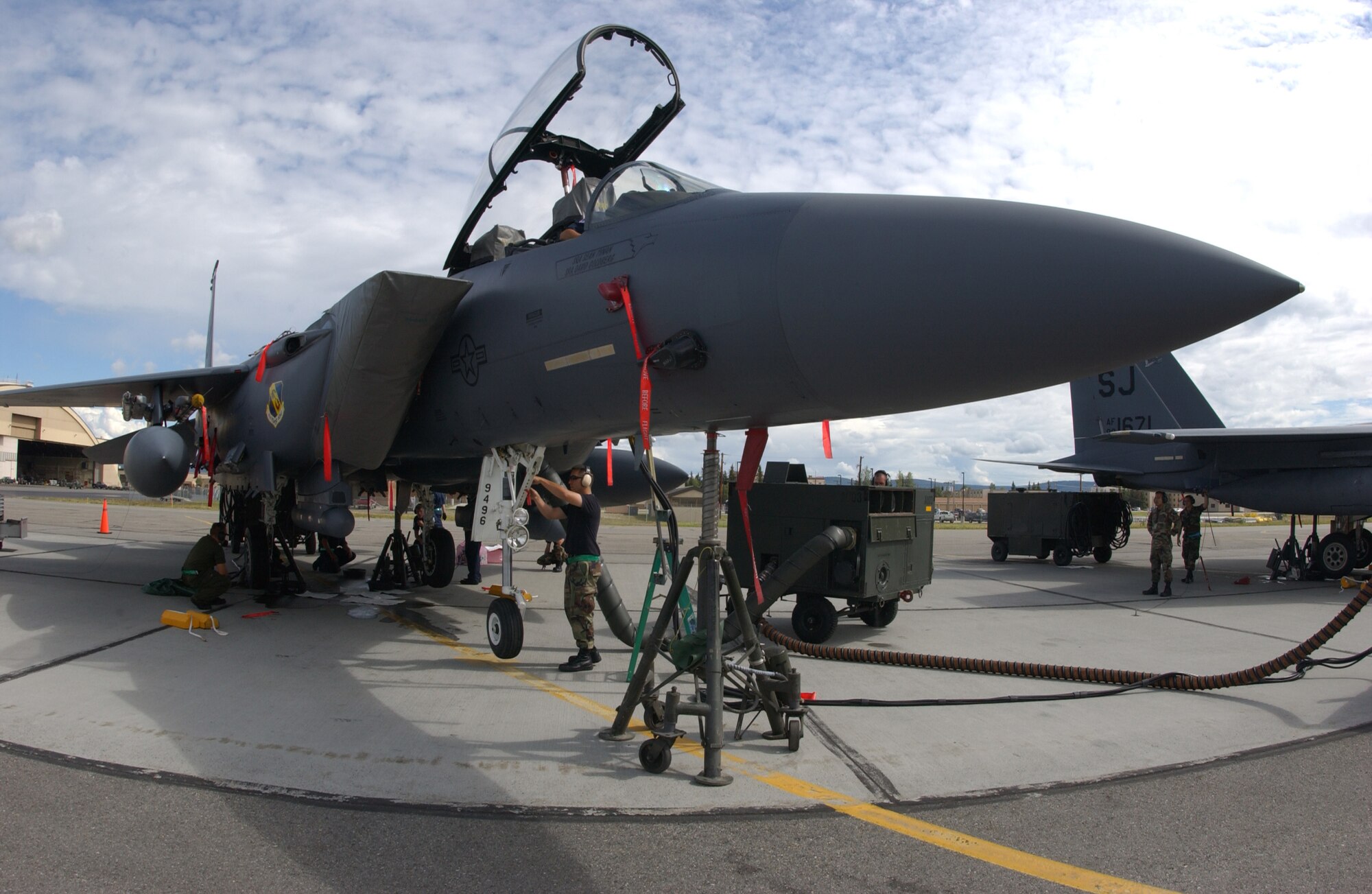 EIELSON AIR FORCE BASE, Alaska -- An Airman of the 335th Aircraft Maintenance Unit, Seymour Johnson Air Force Base, N.C., performs a "jack-retract" on a F-15E Strike Eagle which is a process used to trouble-shoot the landing gear July 12. Red Flag-Alaska 07-3 is a Pacific Air Forces-directed field training exercise for U.S. and coalition forces flown under simulated air-combat conditions. It is conducted on the Pacific Alaska Range Complex with air operations flown out of Eielson and Elmendorf Air Force Bases. (U.S. Air Force Photo by Airman 1st Class Jonathan Snyder)