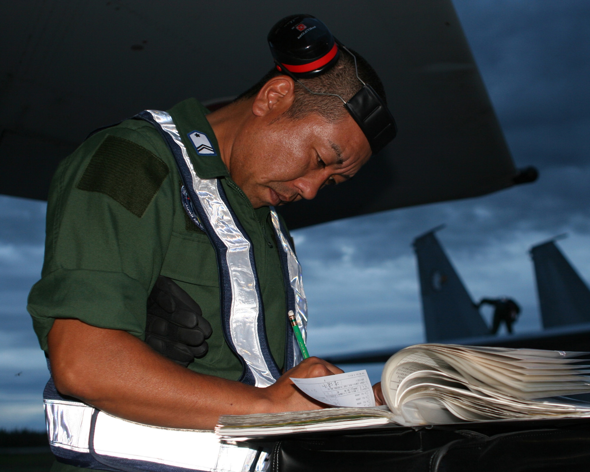 EIELSON AIR FORCE BASE, Alaska --Tech. Sgt. Youichi Kudo Staff completes post flight procedures for an F-15J here shortly after midnight July 11. The 7th Air Wing of the Japan Air Self-Defense Force arrived with six F-15J aircraft to participate in Red Flag-Alaska exercise July 12-27. The exercise is focused on improving the combat readiness of U.S. forces and providing training for units preparing for air expeditionary force taskings. International partners will include Japan, Mongolia, Spain, Thailand, Turkey and NATO. (U.S. Air Force photo by Capt. Tana R.H. Stevenson)