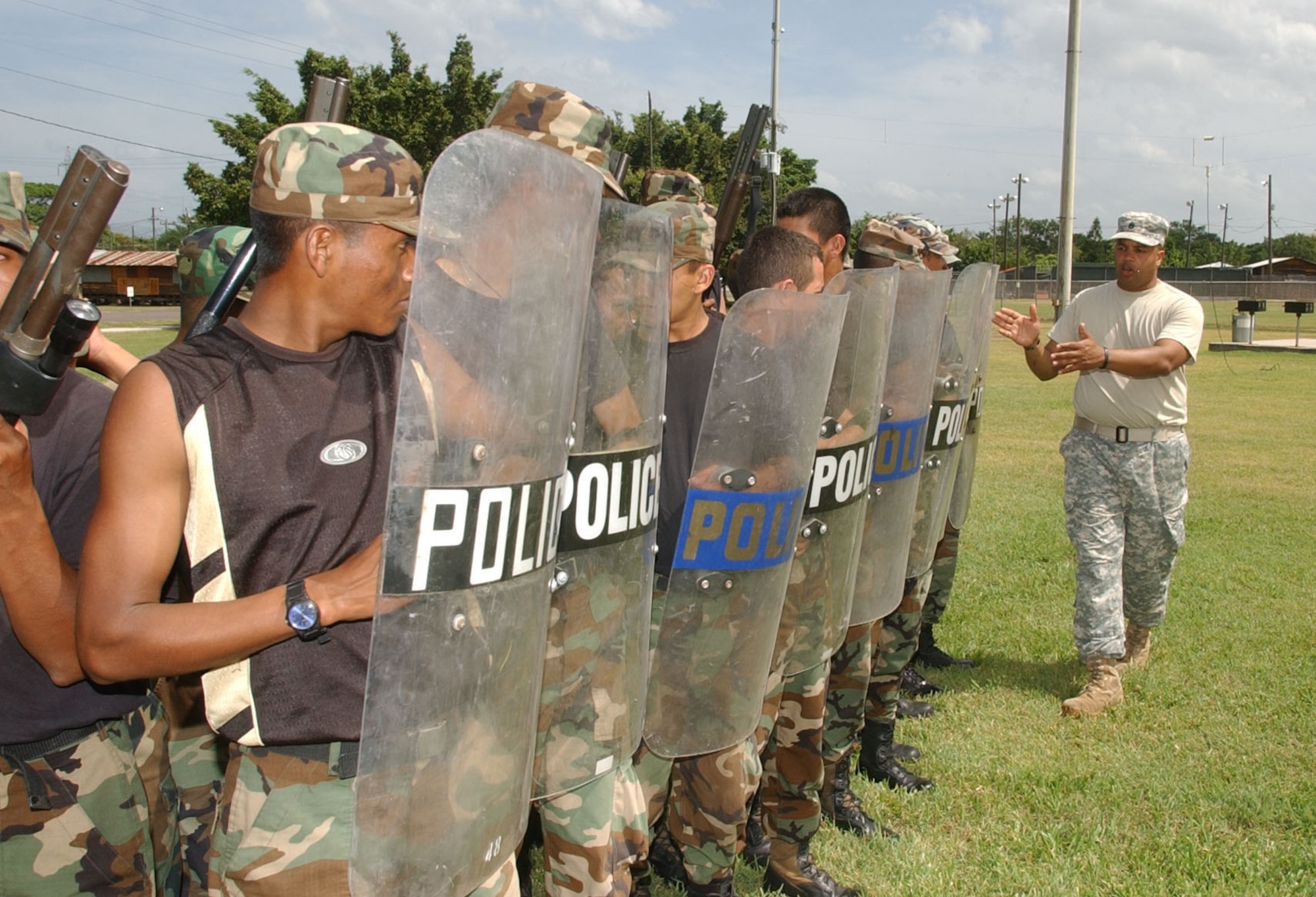 SOTO CANO AIR BASE, Honduras -- Army Staff Sgt. Pablo Canales, U.S. Army South Provost Marshall's Office, lines up students during a Honduran Military Police training class July 12, 2007.  (U.S. Air Force Photo/Martin Chahin)