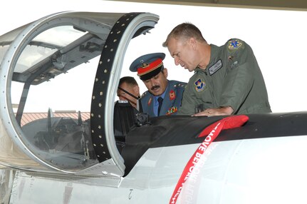Lt. Col. Chris Schweinsberg (right), of the 559th Flying Training Squadron, shows Maj. Gen. Mohammad Dawran, Afghan National Army Air Corps commander, a T-6 Texan II on the west flight line Monday. (U.S. Air Force photo by Joel Martinez)