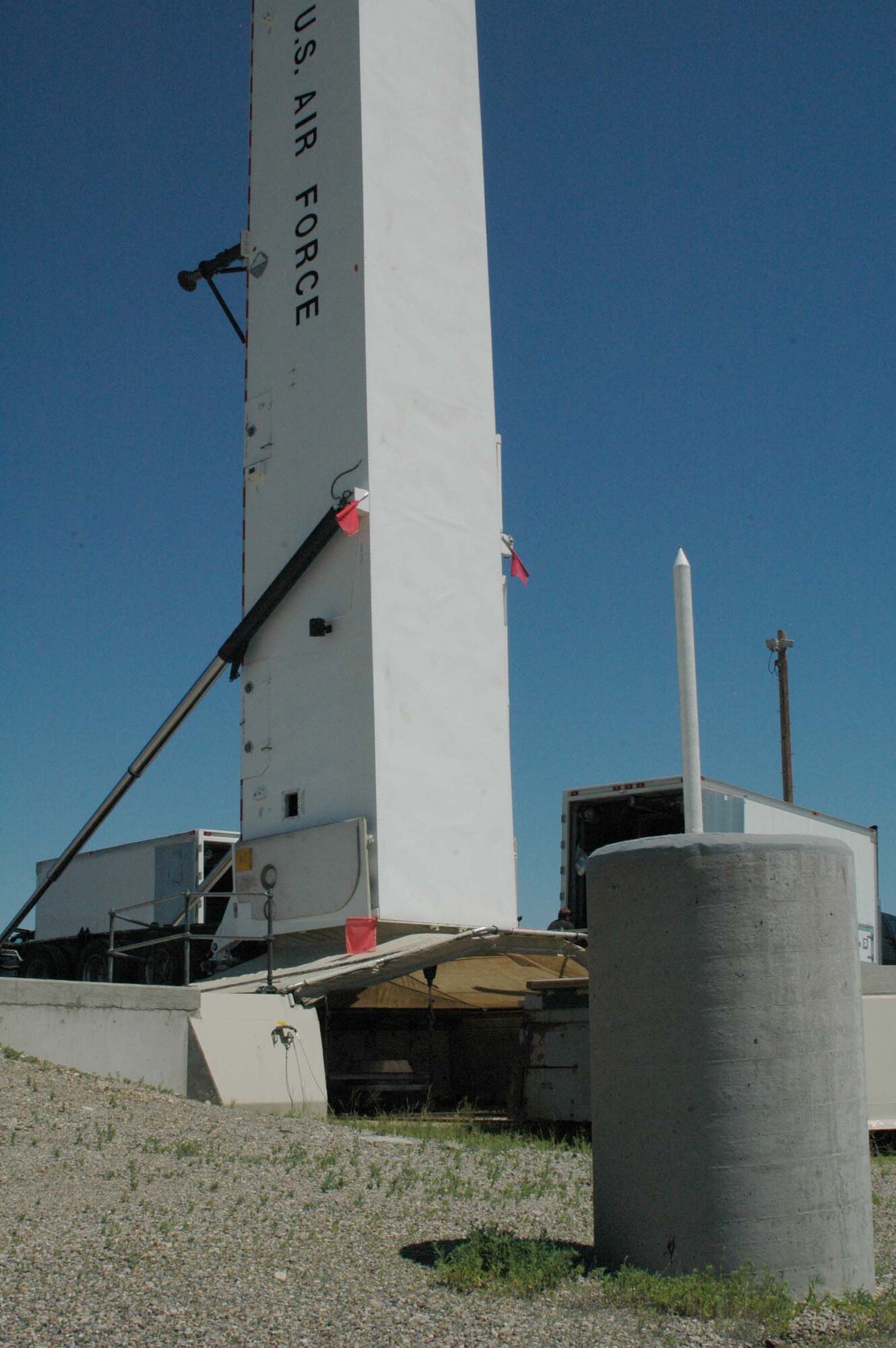 The downstage of the intercontinental ballistic missile located at Sierra-38 launch facility is lifted into the transport erector July 12. This mission completed the first missile removal beginning the deactivation process of the 564th Missile Squadron's weapon systems. (U.S. Air Force photo/Valerie Mullett)