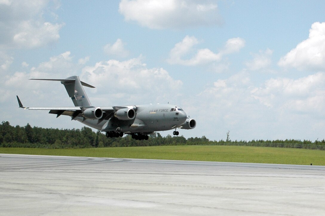 A C-17 Globemaster III from the Mississippi Air National Guard's 172nd Airlift Wing lands at the new assault training runway at Camp Shelby, Miss., July 9.  The 210-acre Shelby Aux Field is one of only two facilities in the world designed for C-17 short-field landing operations. It was constructed to meet Air Force C-17 training requirements.  (U.S. Air Force photo/Tech. Sgt. Mike R. Smith)