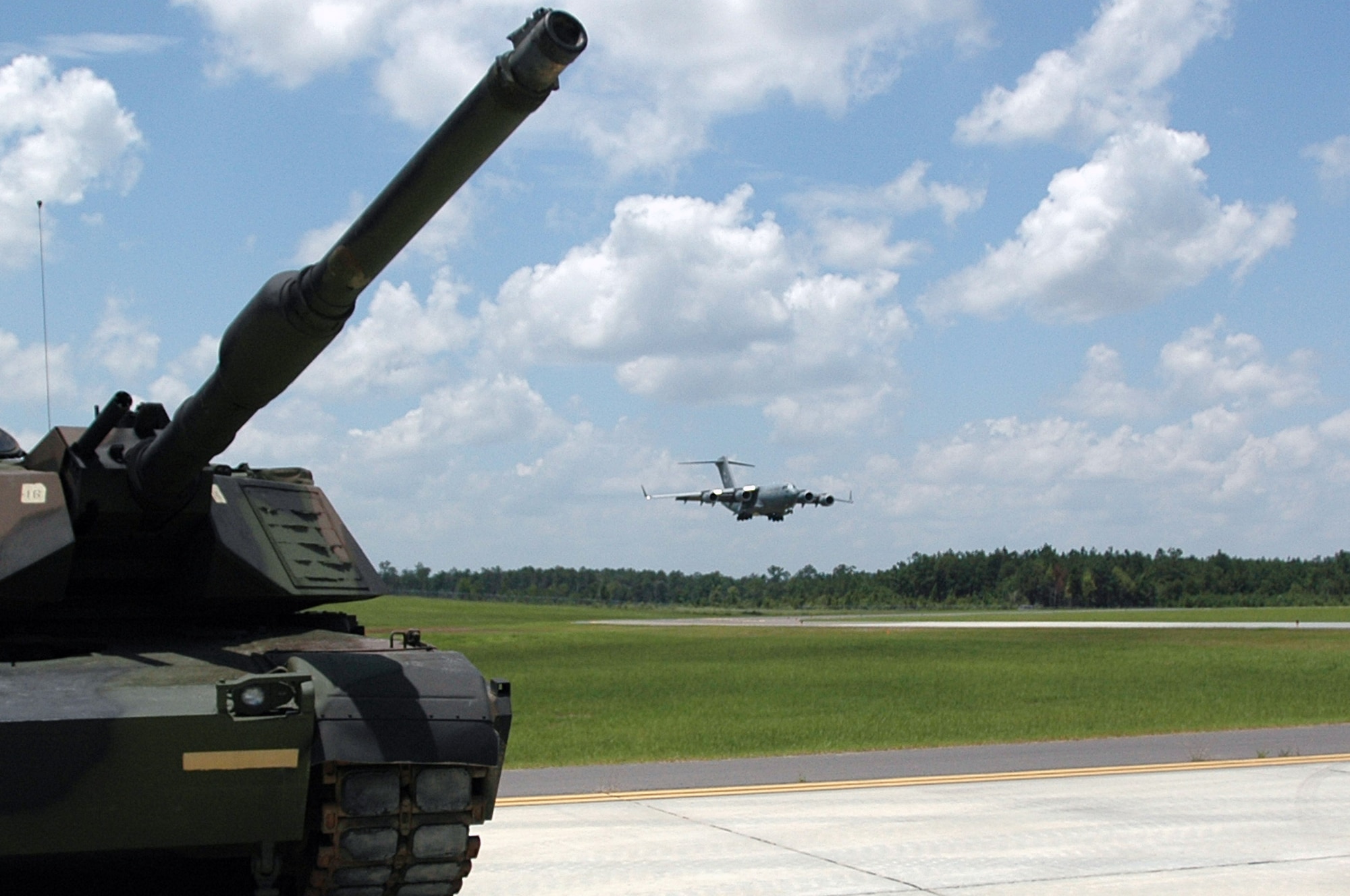 A C-17 Globemaster III from the Mississippi Air National Guard's 172nd Airlift Wing lands at the new assault training runway at Camp Shelby, Miss., July 9.  The 210-acre Shelby Aux Field is one of only two facilities in the world designed for C-17 short-field landing operations. It was constructed to meet Air Force C-17 training requirements.  (U.S. Air Force photo/Tech. Sgt. Mike R. Smith)