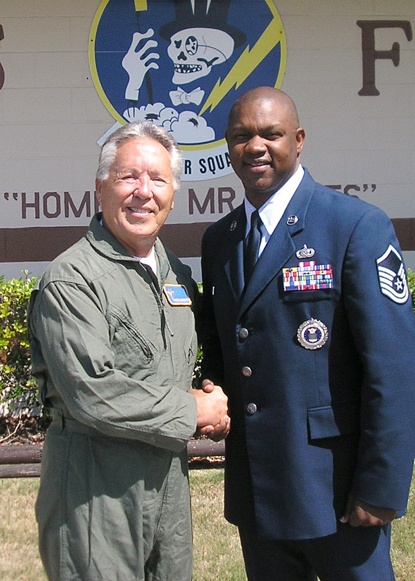 Aldo Andretti shaking hands with Master Sgt. Vernon Grant, 331st Recruiting Squadron flight chief, and prior to Andretti's F-15 incentive ride July 11 at Tyndall AFB, Fla. Aldo is the twin brother of racing superstar Mario Andretti and the father of NASCAR driver John Andretti. The Andretti’s are considered the first family of American racing and instrumental in assisting AF recruiting efforts at NASCAR events this year. The incentive flight was set up to provide a better understanding of an Air Force F-15 aerial mission. (U.S. Air Force photo)