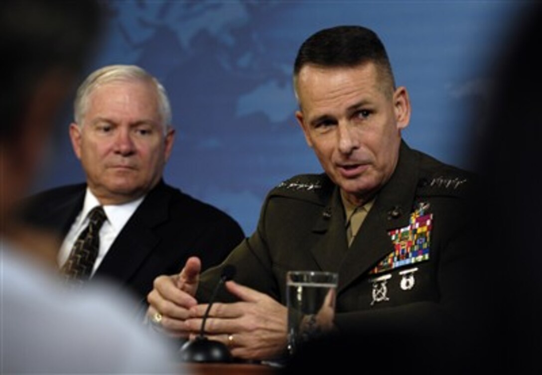 Chairman of the Joint Chiefs of Staff U.S. Marine Gen. Peter Pace (right) responds to a question during a press conference with Defense Secretary Robert M. Gates at the Pentagon, July 13, 2007.  