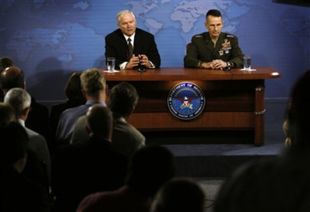 Defense Secretary Robert M. Gates responds to a question during a press conference with Chairman of the Joint Chiefs of Staff U.S. Marine Gen. Peter Pace at the Pentagon, July 13, 2007.  
