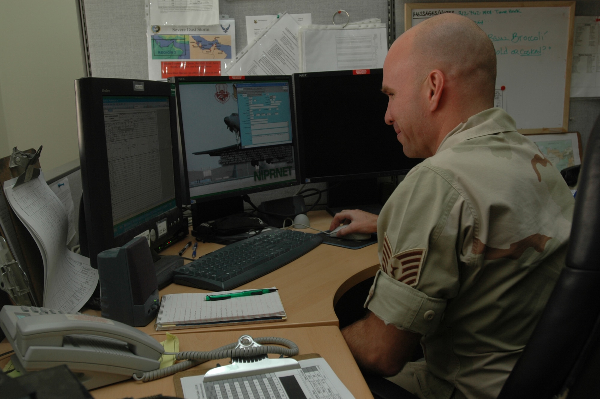 Tech. Sgt. Jamie Ceier, 379th Expeditionary Operations Support Squadron Combat Weather Team and a native of Key West, Fla., looks up observation trends. Sergeant Ceier is deployed here from Offutt Air Force Base, Neb. (U.S. Air Force photo by Senior Airman Clark Staehle)