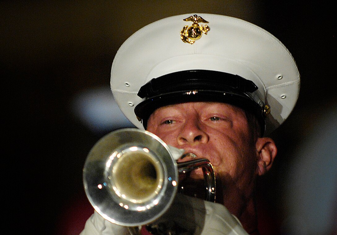 "The Commandant's Own" The United States Marine Drum and Bugle Corps performs during an evening parade hosted by Chairman of the Joint Chiefs of Staff, U.S. Marine Gen. Peter Pace, at the Marine Barracks, Washington, D.C., July 13, 2007.  