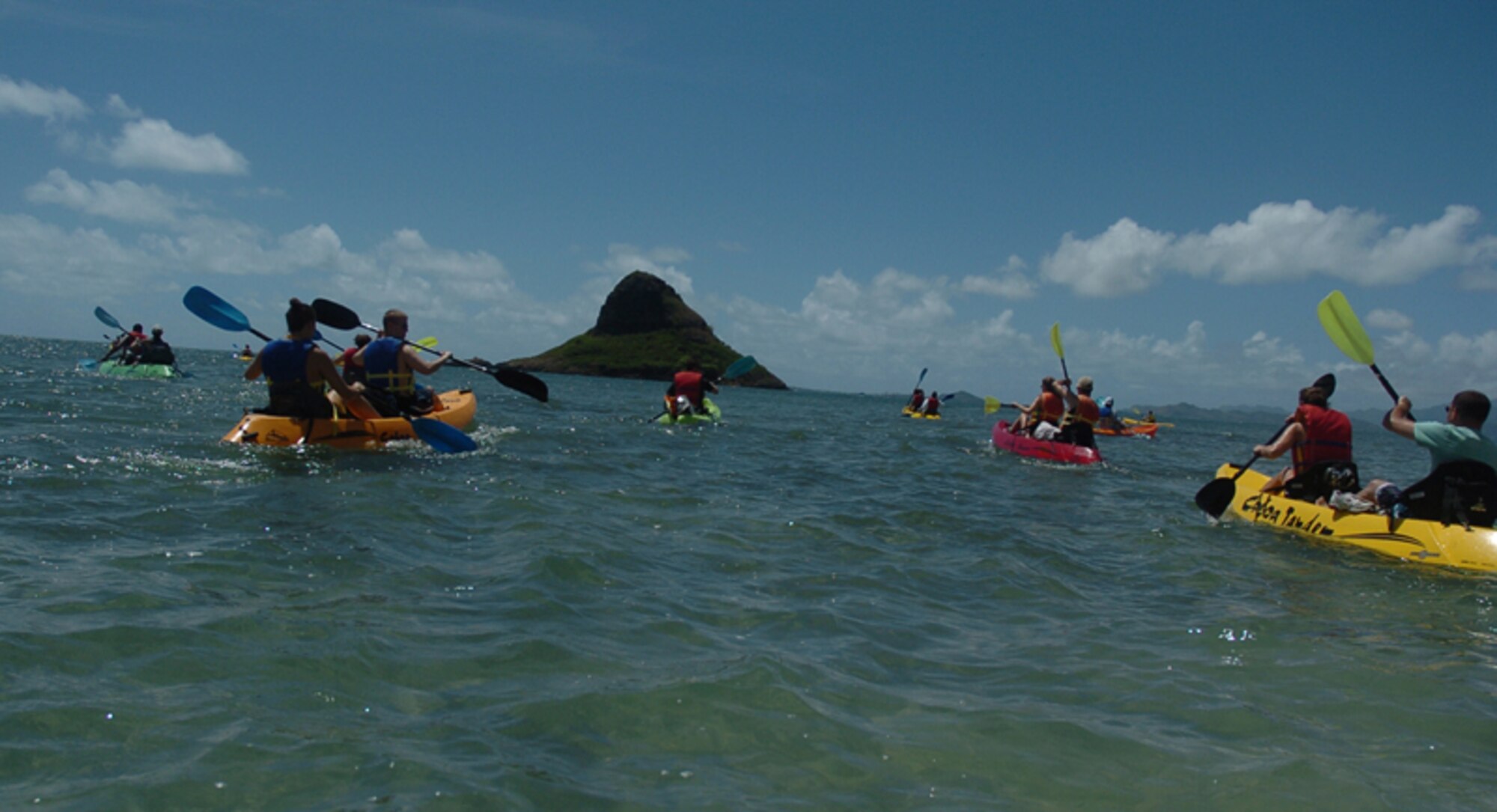 The adventure team gets their paddling set to stride on the way to their next destination.  Photo by Mark Munsey