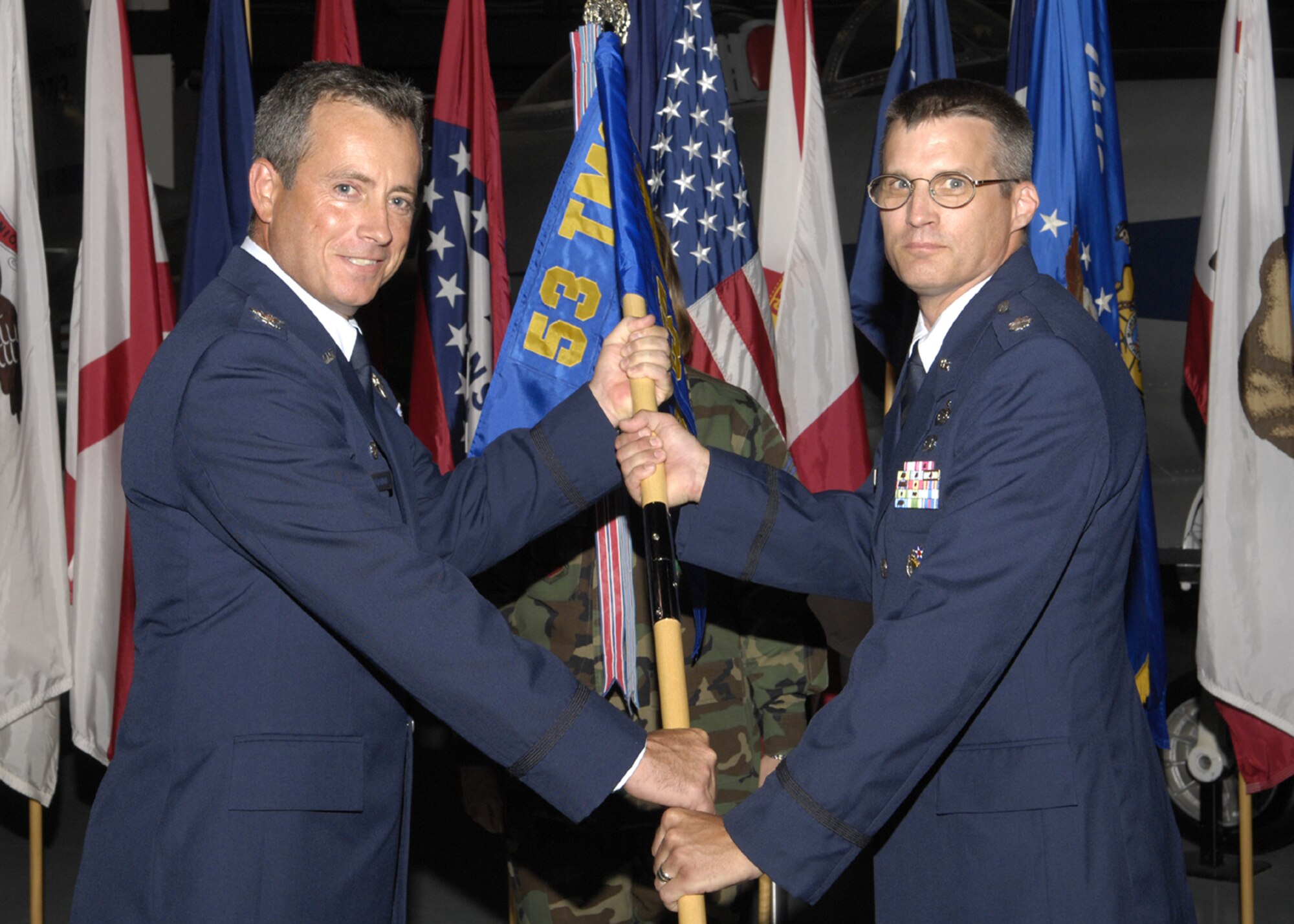 EGLIN AIR FORCE BASE, Fla. -- Lt. Col. Rigel Hinckley, 53d Computer Systems Squadron, accepted the squadron guidon from Col. Thomas Berghoff, 53d Test Management Group commander, during a change of command ceremony July 9.  Colonel Hinckley replaced Colonel select Kenryu Bryson who is now the deputy group commander of the 55th Communications Group at Offutt Air Force Base, Neb.