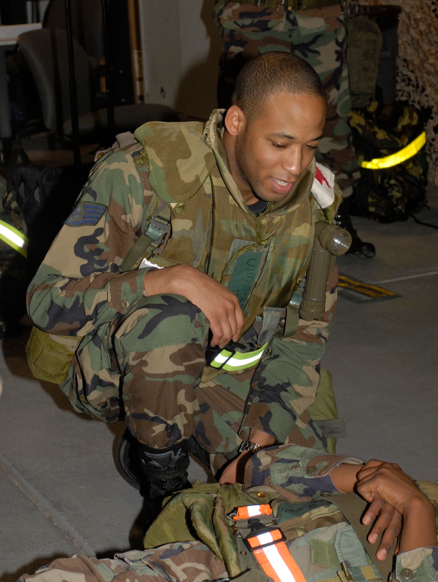 KUNSAN AIR BASE, Republic of Korea -- Staff Sgt. Kamau Joseph, from the 8th Medical Support Squadron, participates in self-aid and budy-care training during the Wolf War Days here July 16. The Wolf War Days is a mini exercise designed to familiarize Airmen with exercise procedures. (U.S. Air Force photo/Staff Sgt. Darcie Ibidapo)
