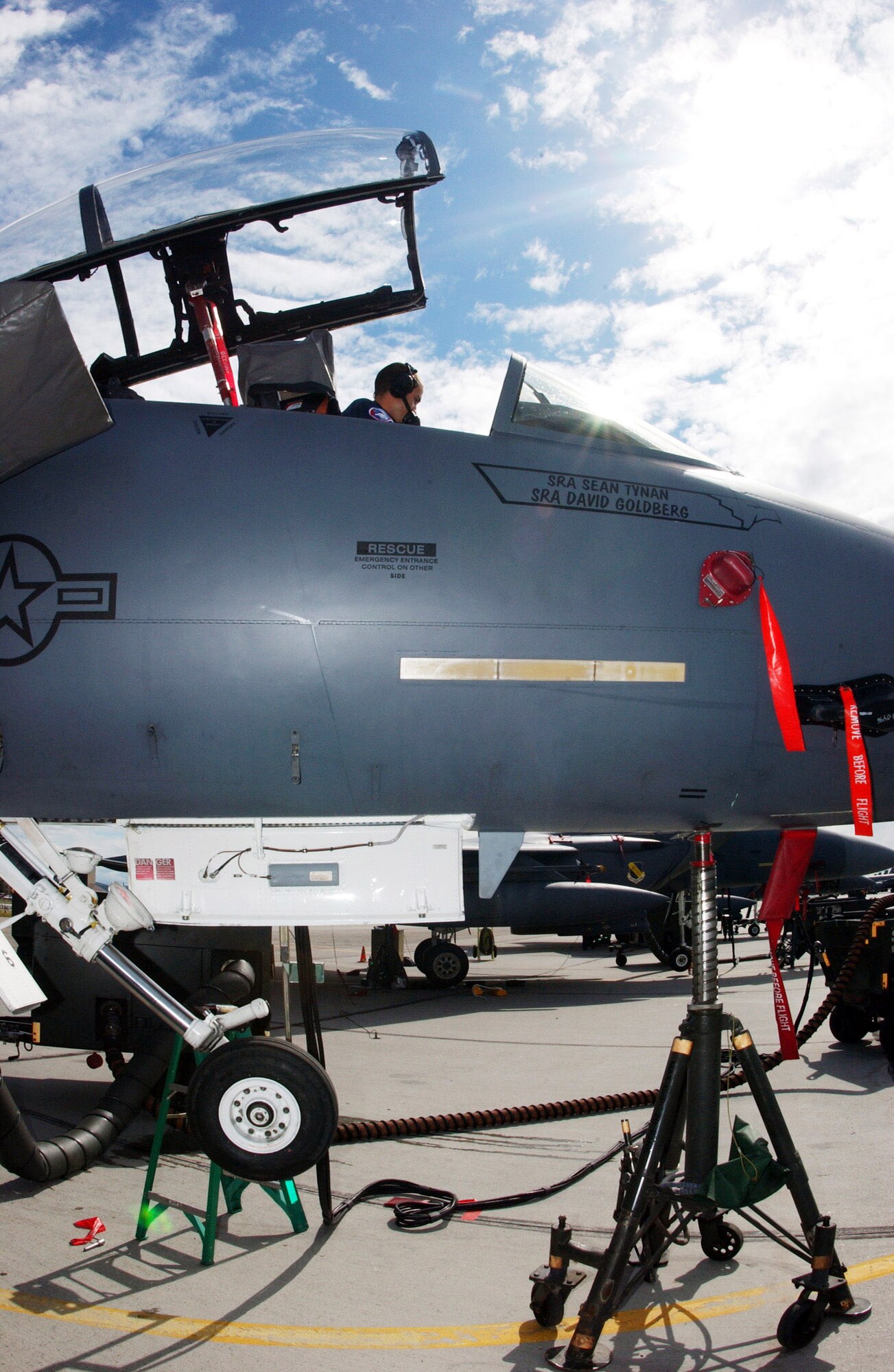 Airman 1st Class Harrison McMillan climbs into the cockpit as he and other maintainers toubleshoot the landing gear during a maintenance check July 12 on an F-15E Strike Eagle that is participating in Red Flag-Alaska 2007 at Eielson Air Force Base, Alaska.  Red Flag-Alaska is a Pacific Air Forces-directed field training exercise for U.S. and coalition forces flown under simulated air-combat conditions.  Airman McMillan is assigned to the 335th Aircraft Maintenance Unit at Seymour Johnson AFB, N.C.  (U.S. Air Force photo/Airman 1st Class Jonathan Snyder)