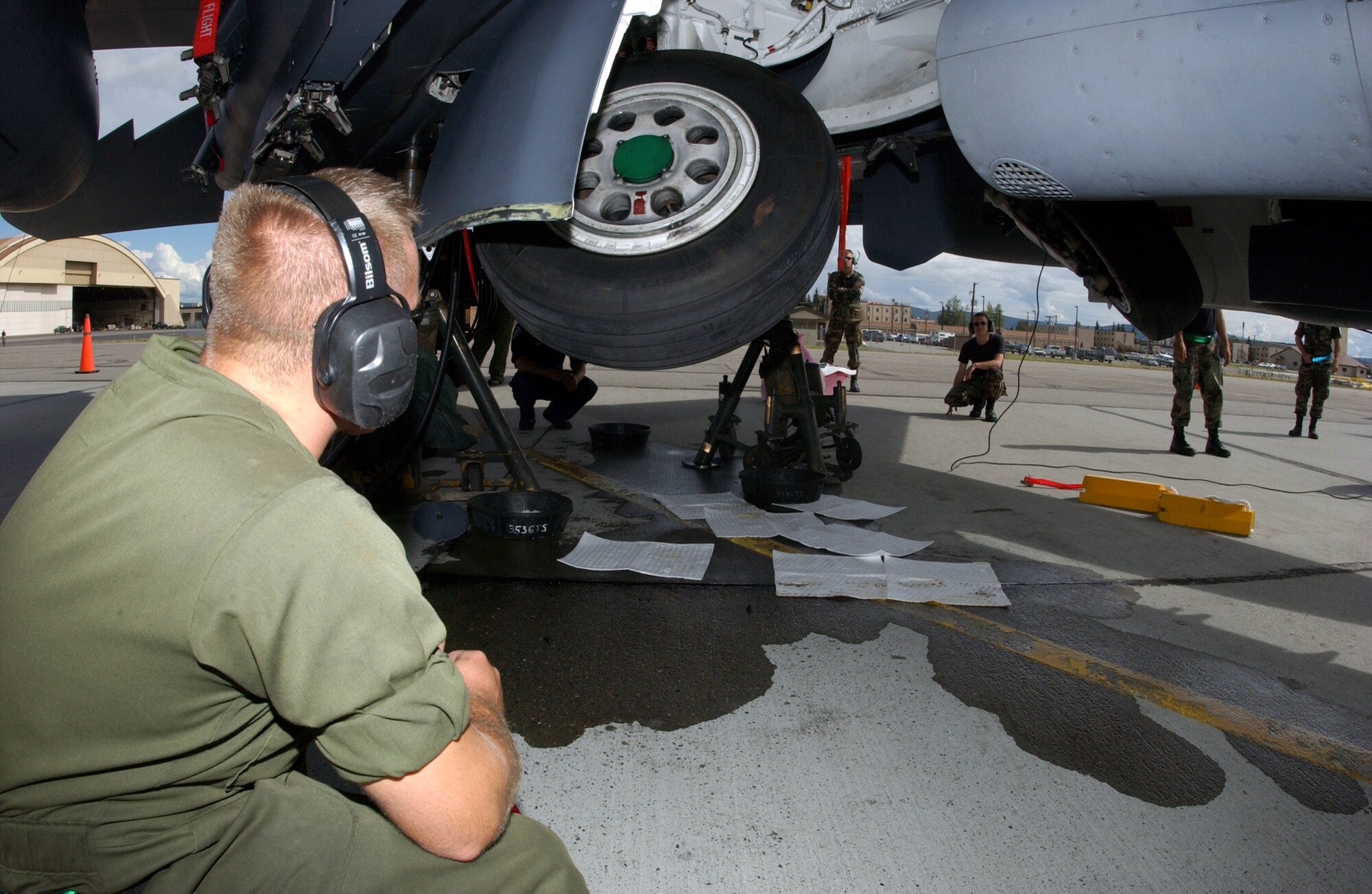 Senior Airman Aaron McGee and other maintainers observe the operation of the landing gear during a maintenance check July 12 on an F-15E Strike Eagle that is participating in Red Flag-Alaska 2007 at Eielson Air Force Base, Alaska.  Red Flag-Alaska is a Pacific Air Forces-directed field training exercise for U.S. and coalition forces flown under simulated air-combat conditions.  Airman McGee is assigned to the 335th Aircraft Maintenance Unit at Seymour Johnson AFB, N.C.  (U.S. Air Force photo/Airman 1st Class Jonathan Snyder)